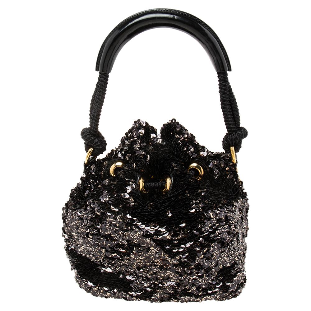 Join the bucket bag trend with this beauty from Louis Vuitton. Covered in sequins, the Mini Noe Rococo bag has a relaxed structure, front logo plaque detail, canvas lining, and a top handle.

Includes: Original Box