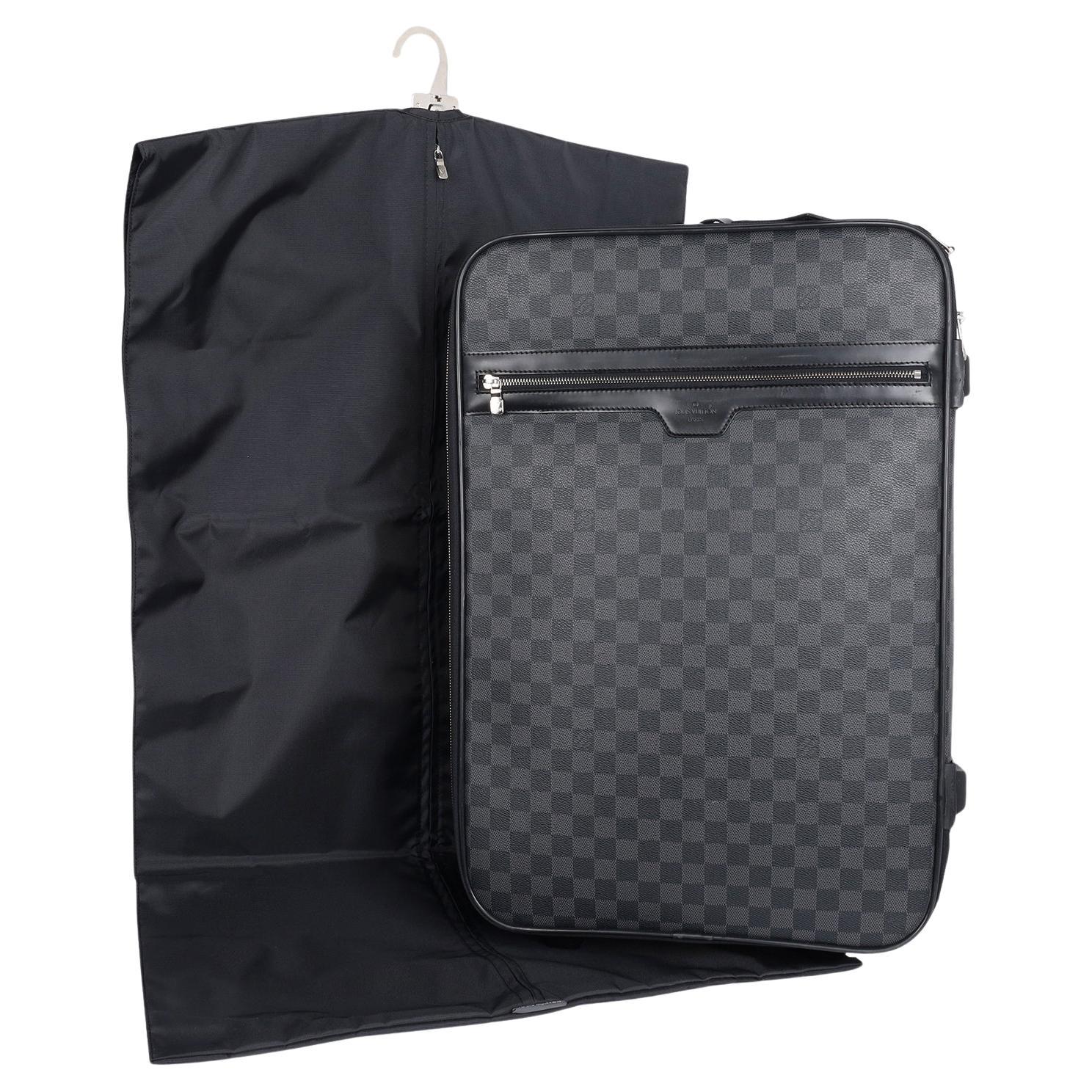 Authentic, pre-loved Louis Vuitton black and grey Damier graphite Pegase 55 roller travel suitcase bag. Features Damier graphite canvas exterior, polyamide lining, shiny silver metallic hardware, telescopic handle, interior zipped compartment for