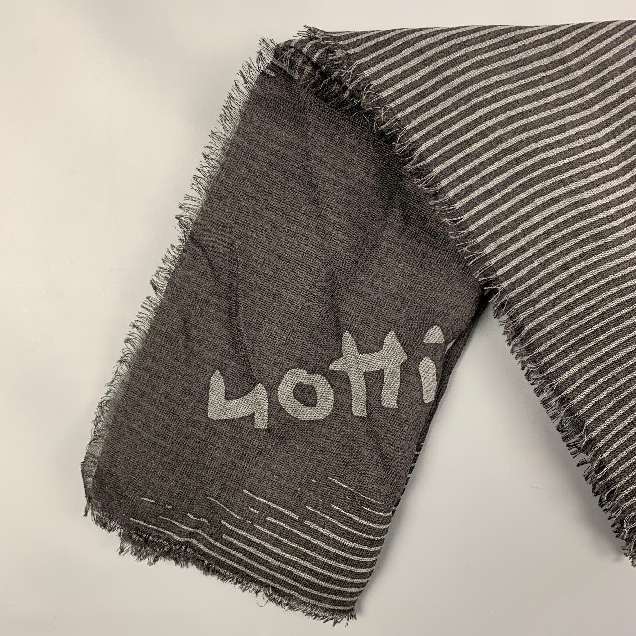 LOUIS VUITTON scarf comes in a black & grey stripe wool / silk with a fringe trim. Made in Italy. Very Good
Pre-Owned Condition. 

Measurements: 
  54 inches  x 54 inches 
  
  
 
Reference: 120136
Category: Scarves
More Details
    
Brand:  LOUIS