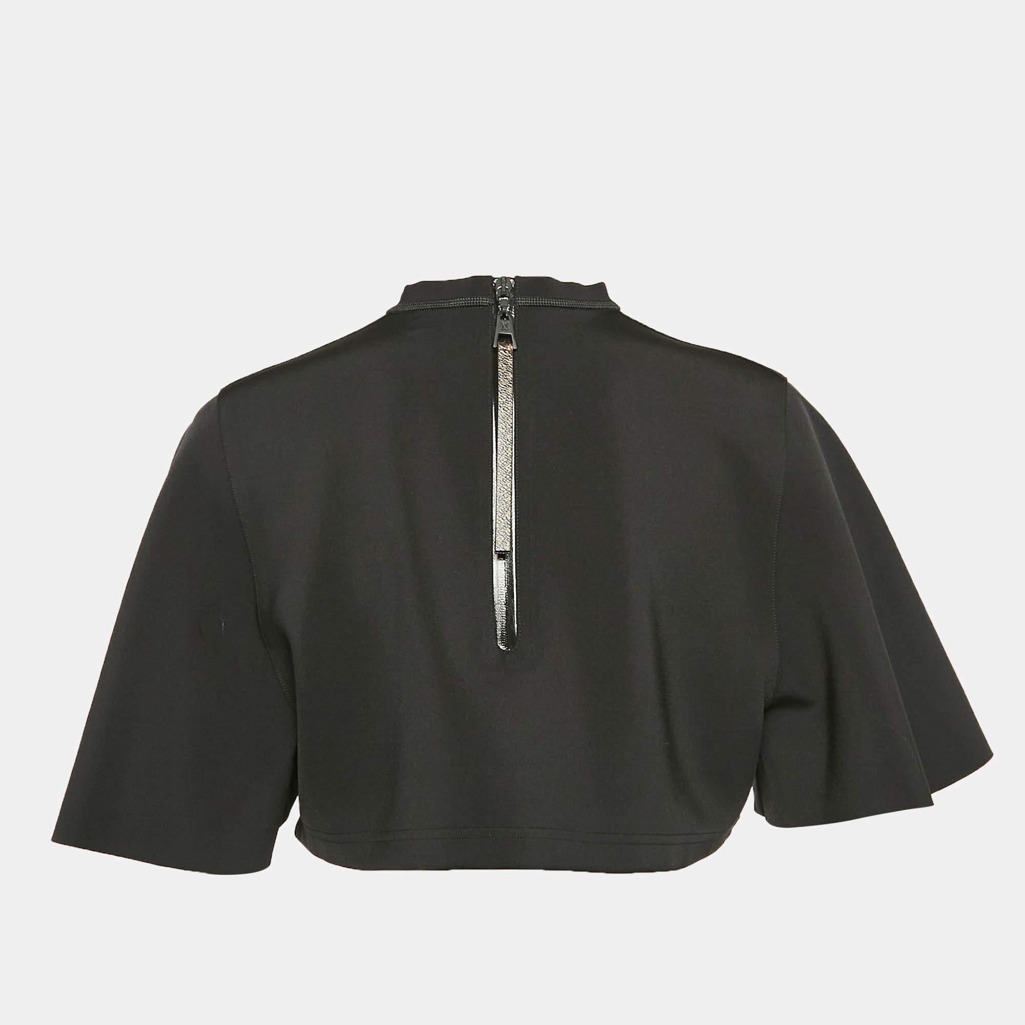Discover effortless chic with this designer crop top. Combining comfort and style in one sleek piece  the top is perfect with skirts and pants. Whether dressed up or down  this crop top adds a touch of sophistication to any outfit.