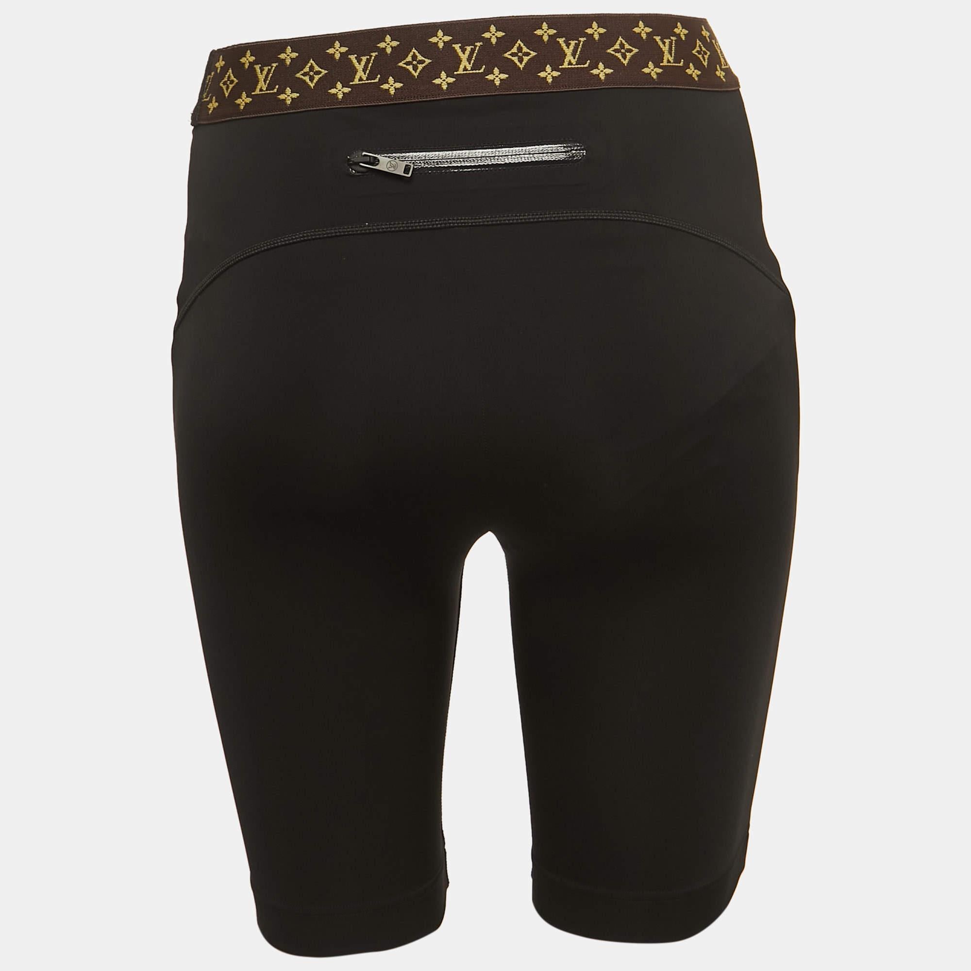 The Louis Vuitton cycling shorts are a high-fashion collaboration piece. They feature a sleek black design with the iconic LV monogram. These cycling shorts blend luxury fashion with sporty functionality, making them a stylish choice for active