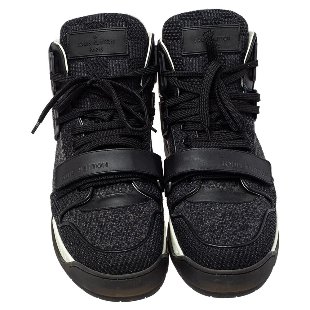 The design of these Louis Vuitton sneakers is characterized by a high-top silhouette rendered in a combination of black knit fabric and leather. They carry lace-ups and velcro straps on the vamps, comfortable insoles, and rubber soles.

Includes: