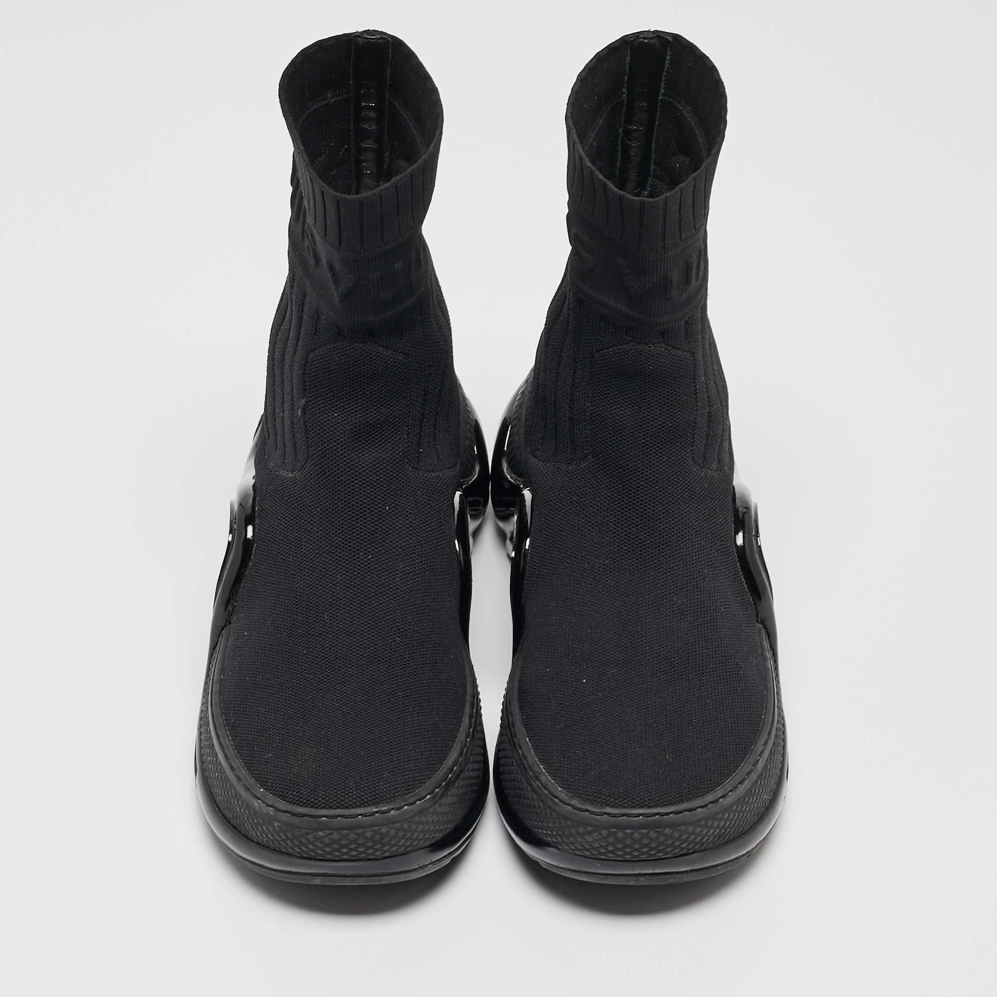 The Louis Vuitton Archlight sneakers effortlessly blend luxury and street style. Crafted with precision, the sleek black knit fabric exudes sophistication. The iconic Archlight sole adds a modern edge, ensuring a fashion-forward statement piece that