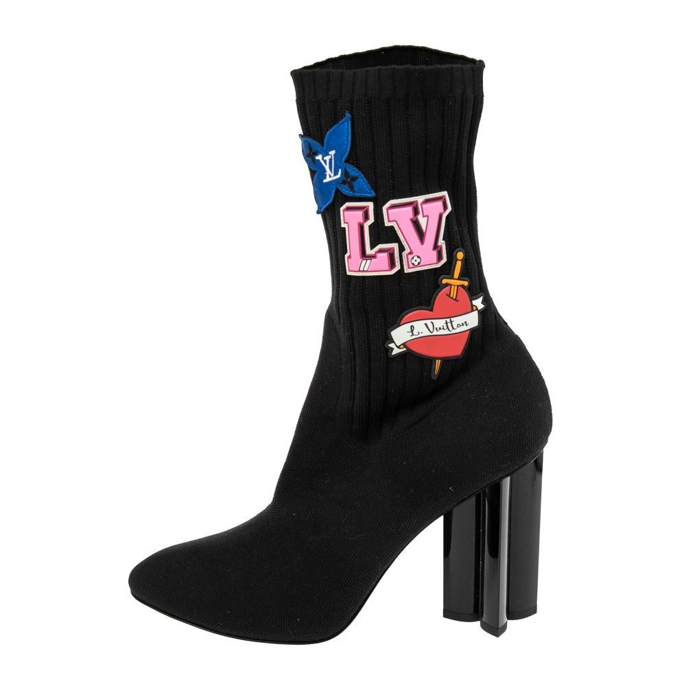 Crafted from knit fabric in a sock design, these Louis Vuitton boots will help you make a fashion statement. They come with covered toes and heels carved as a monogram flower. Get these boots right away.

Includes: Original Dustbag