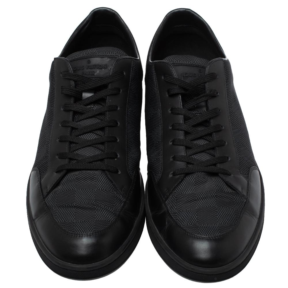 This pair of low-top sneakers from Louis Vuitton is what your wardrobe has been missing all this while! The black sneakers are crafted from leather and canvas and feature round toes, lace-ups on the vamps, and brand details on the tongues.