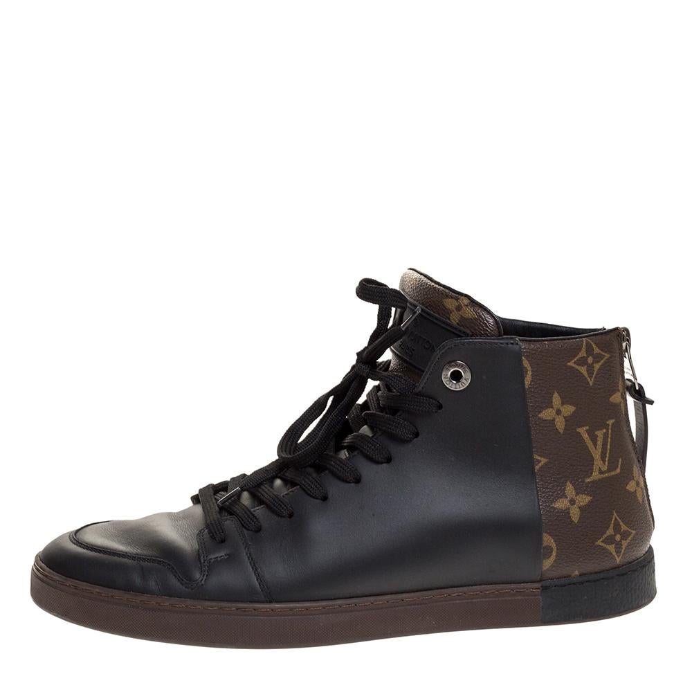 Keep your look edgy and cool with these Louis Vuitton sneakers. Designed in a high-top silhouette, this pair features a black leather body enhanced with monogrammed canvas counters, lace-ups and zippers. They are set on a thick rubber sole that not
