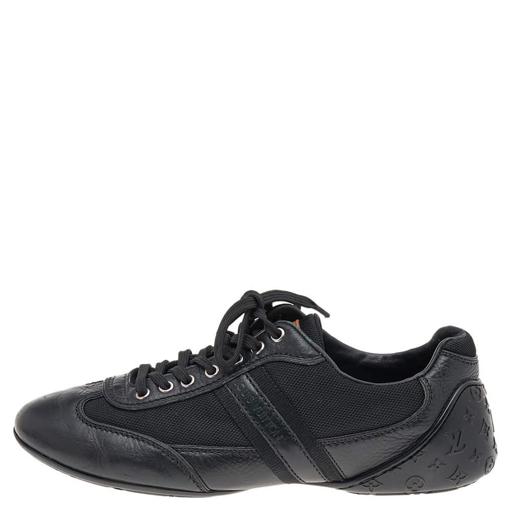 Coming in a classic low-top silhouette, these Louis Vuitton sneakers are a seamless combination of luxury, comfort, and style. They are made from leather and nylon in a black shade. These sneakers are designed with logo details, laced-up vamps, and