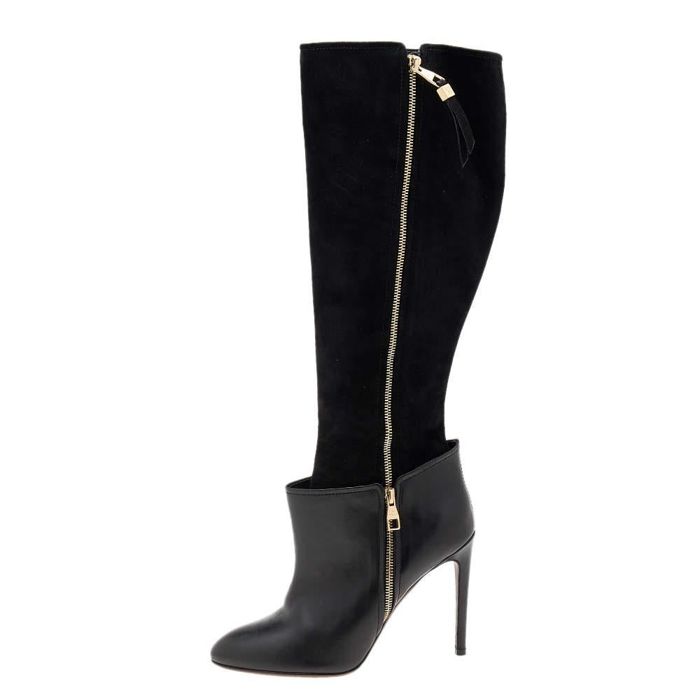Crafted from leather and suede, these Louis Vuitton knee-length boots have a stylish shape and slender 10.5 cm heels. The black boots come with gold-tone zippers and insoles that are leather padded. Rock them with a fitted dress!

