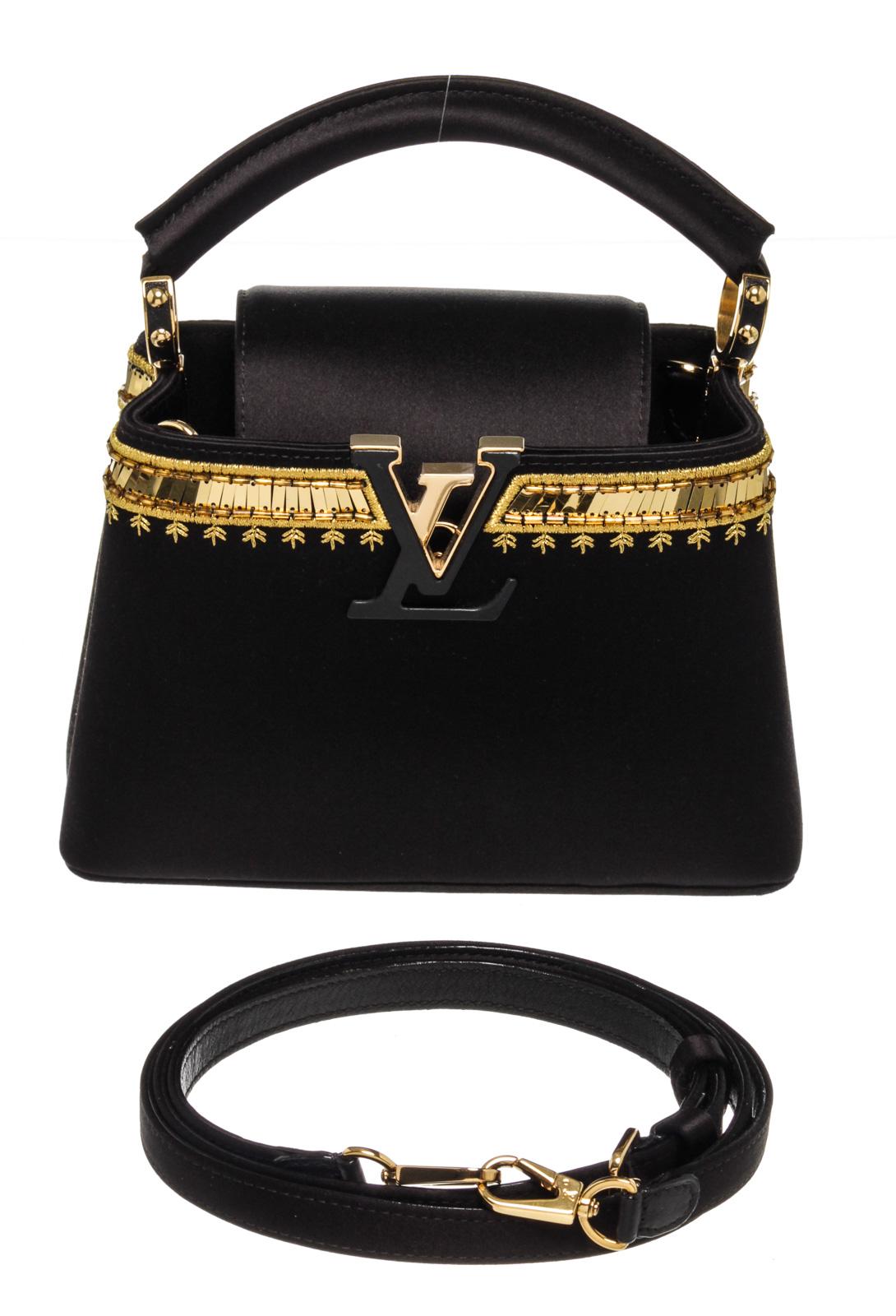 Louis Vuitton Black Leather Capucines Satin Handbag with leather, gold-tone hardware, leather trim, interior slip pocket, top handle and zipper closures.

50330MSCÂ