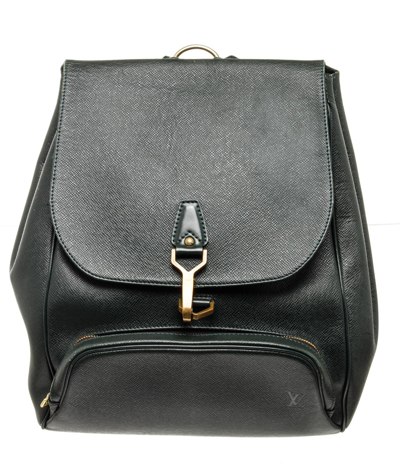 Louis Vuitton Black Leather Cassia Briefcase Bag with leather, gold-toneÂ hardware, trim tan vachetta leather,Â exteriorÂ zip pocket, interior zip pocket,Â shoulder strapÂ andÂ snapÂ closure.

48716MSCÂ