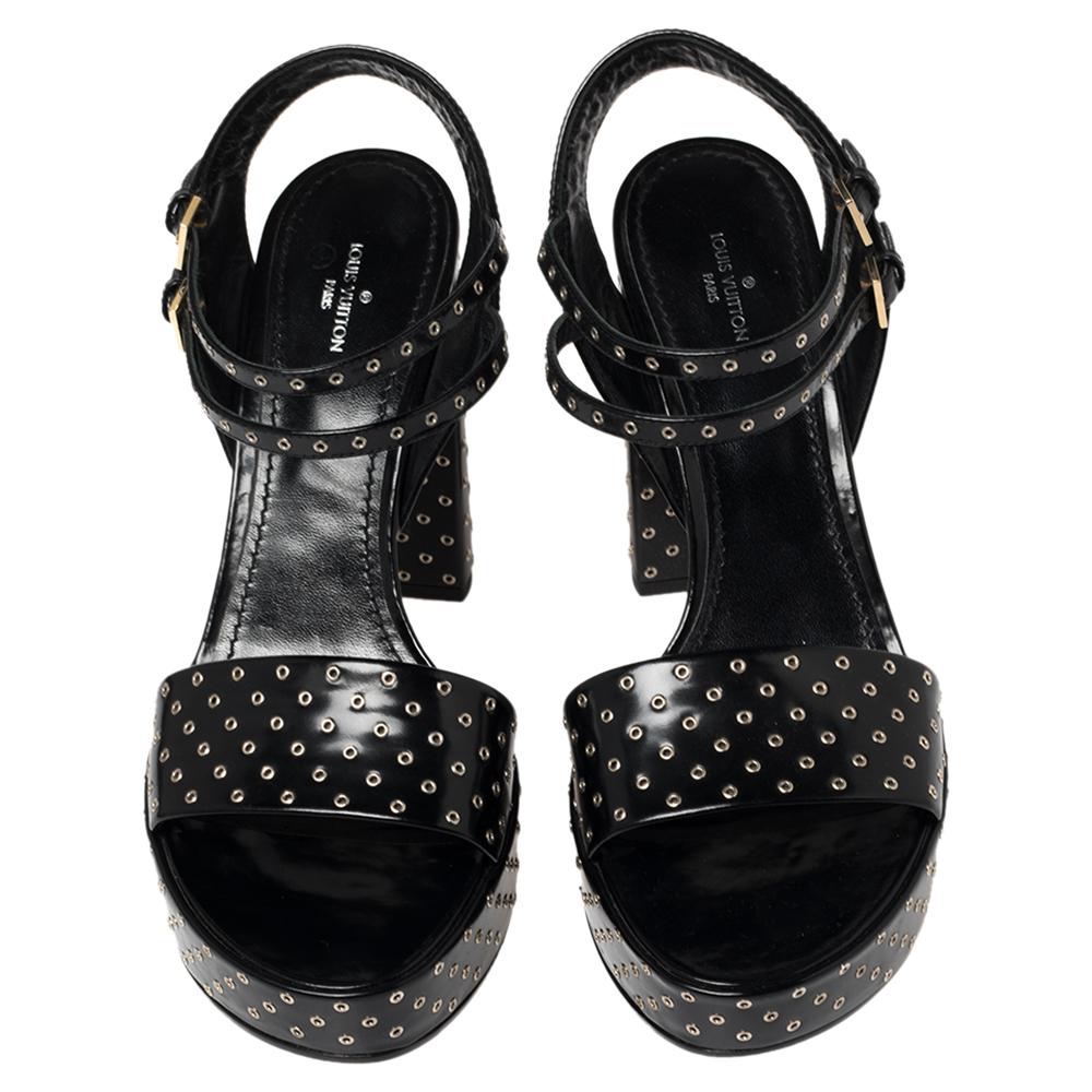 Gorgeous and glamorous, these sandals from Louis Vuitton are sure to add sparks of luxury to your wardrobe! These black ones flaunt eyelet embellishments all over—on the vamps, platforms, ankle straps, and the block heels. They look stunning!