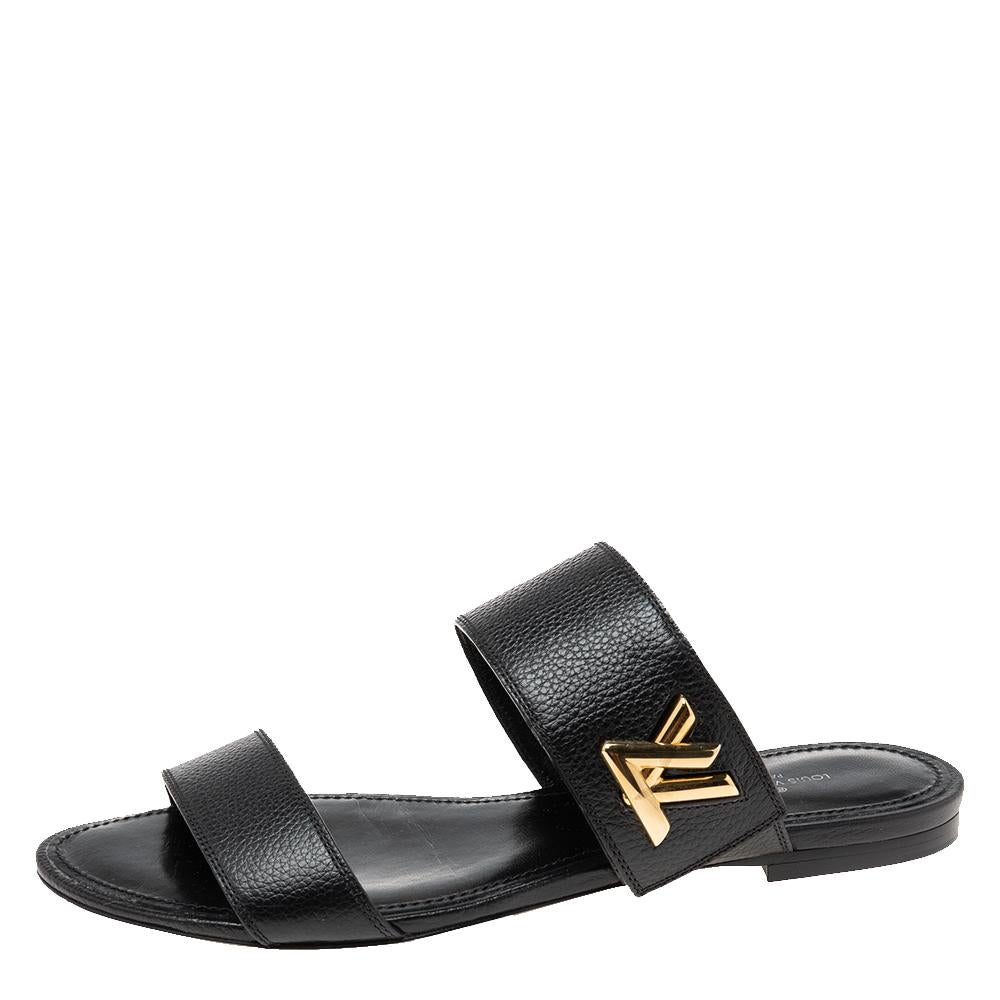 These Louis Vuitton slide sandals make an ideal daily wear companion that provides excellent support. Crafted in Italy, they are made from quality leather and come in black. They feature crisscross uppers and are finished with the LV logo and