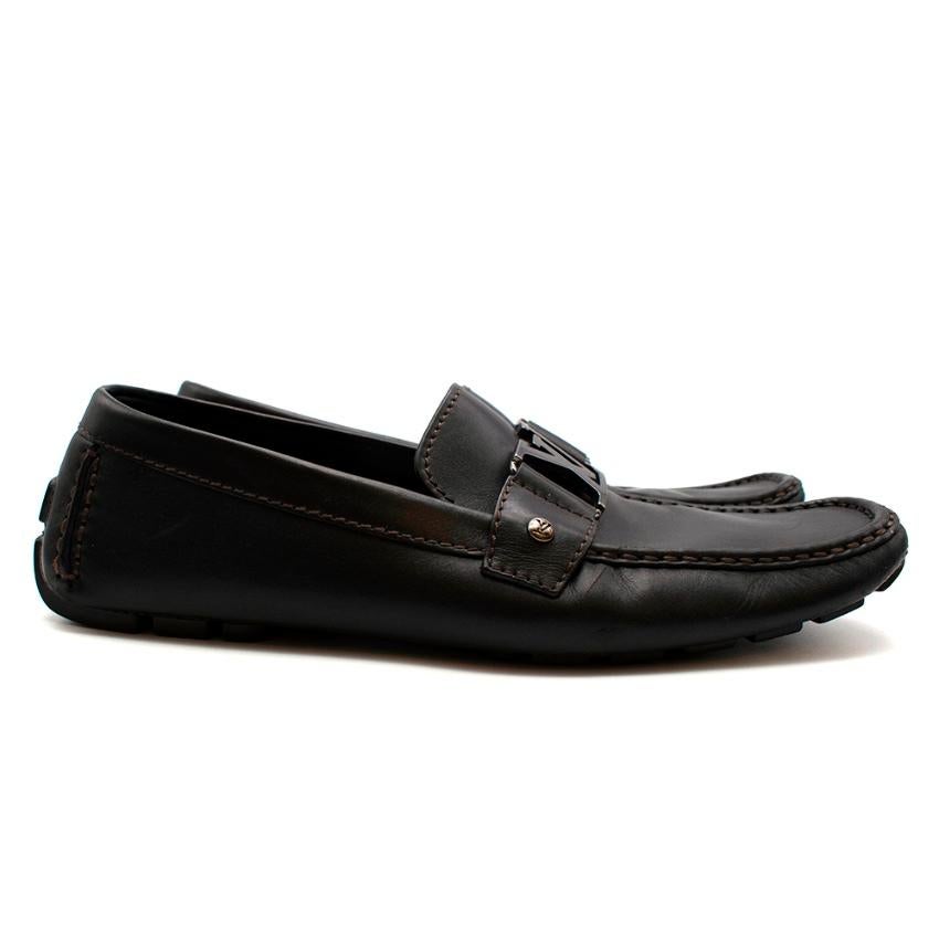Louis Vuitton Black Leather Logo Loafers

-Classic style 
-Graphite logo buckle 
-Brande on the back 
-Rubber soles for extra adherence 
-Luxurious soft padded leather lining for comfort   

Materials:

Main: leather 
Lining: leather
Soles: leather