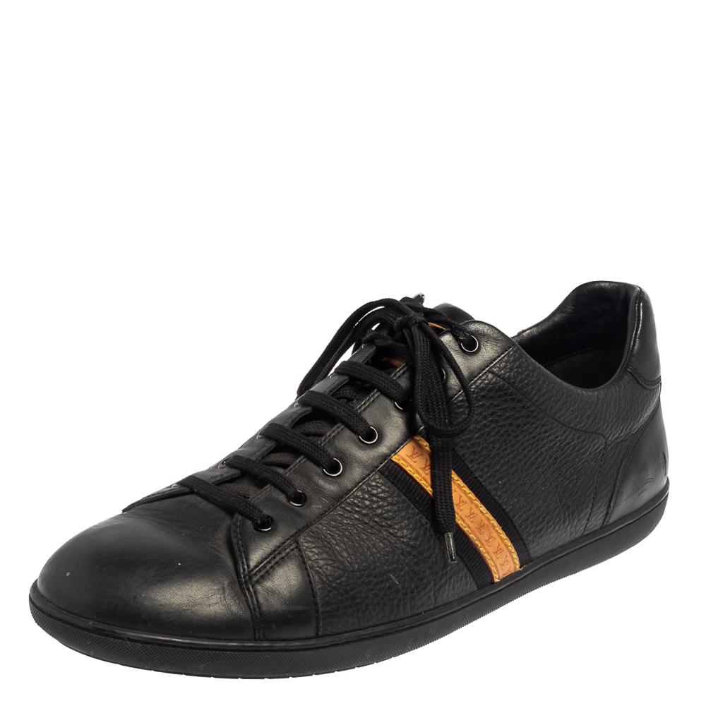 This classy and casual pair of low-top sneakers from Louis Vuitton is a must-have! They are made of quality leather and come in a lovely shade of black. It flaunts the logo on the sides, lace-ups on the vamps, and is complete with rubber soles.

