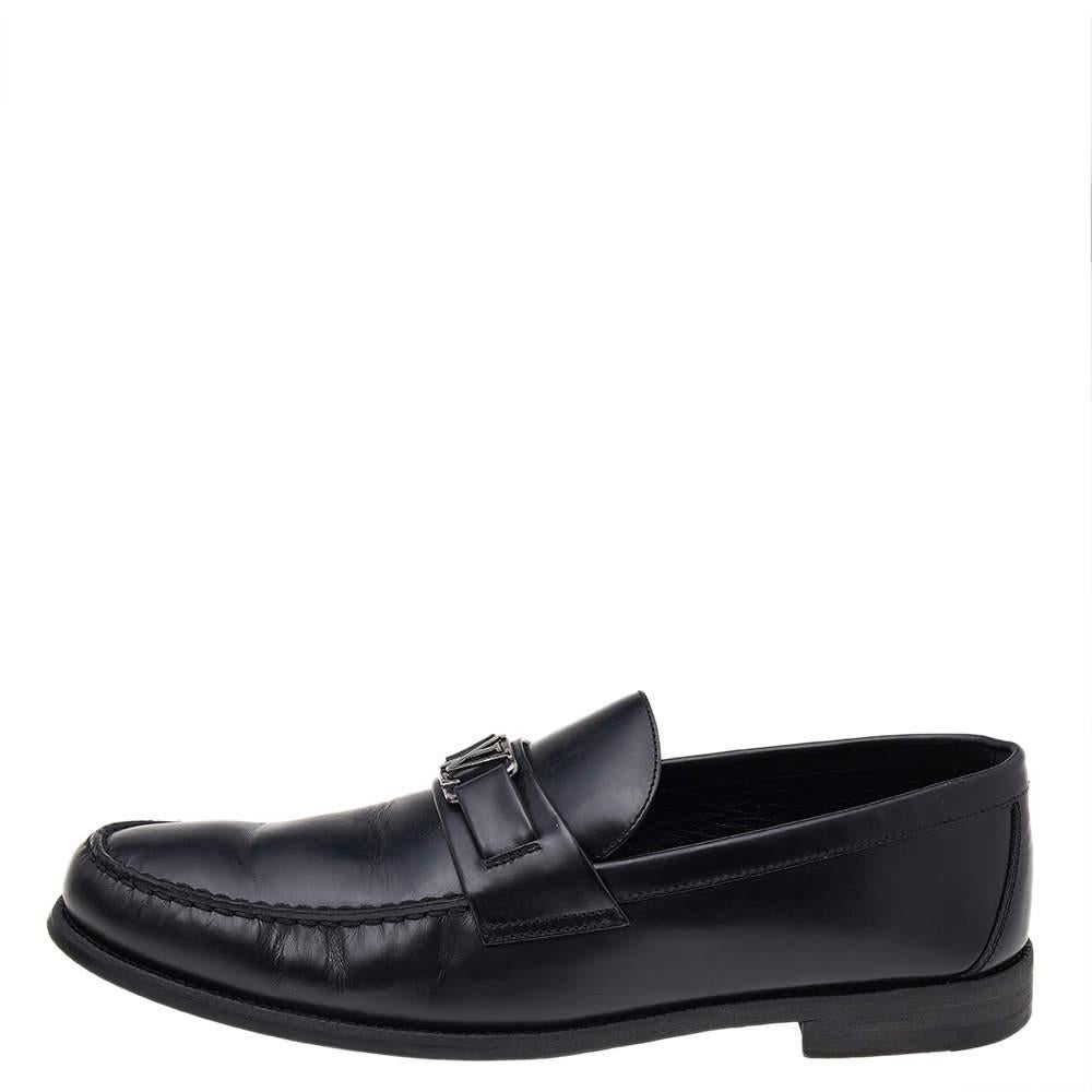 Crafted with beauty using Leather, this pair of loafers by Louis Vuitton is a blend of luxury and comfort. They feature the signature LV on the uppers in gunmetal-tone, leather-lined insoles and tough soles. The loafers have a luxe structure and are