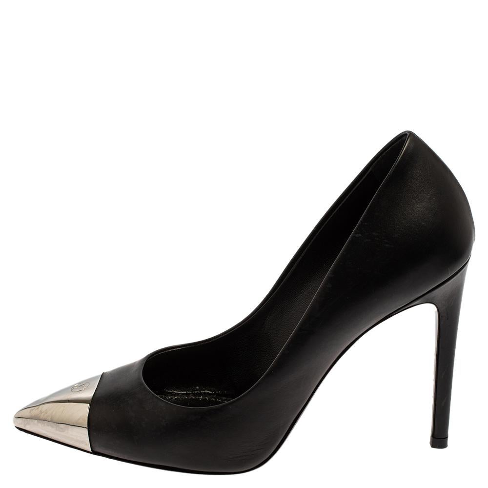 A classic pair of black shoes with a twist, these Louis Vuitton Merry Go Round pointed-toe pumps are perfect to dress up your formal and evening looks with minimal effort. Crafted in black leather, these shoes feature silver-tone metal cap toe and