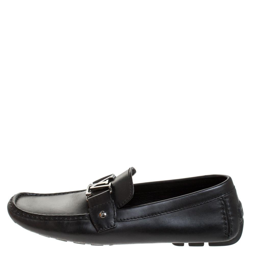 Look sharp and neat with this pair of Monte Carlo loafers from Louis Vuitton. They have been crafted from black leather and designed with the art of fine stitching and the signature LV on the uppers. The pair is complete with comfortable insoles and
