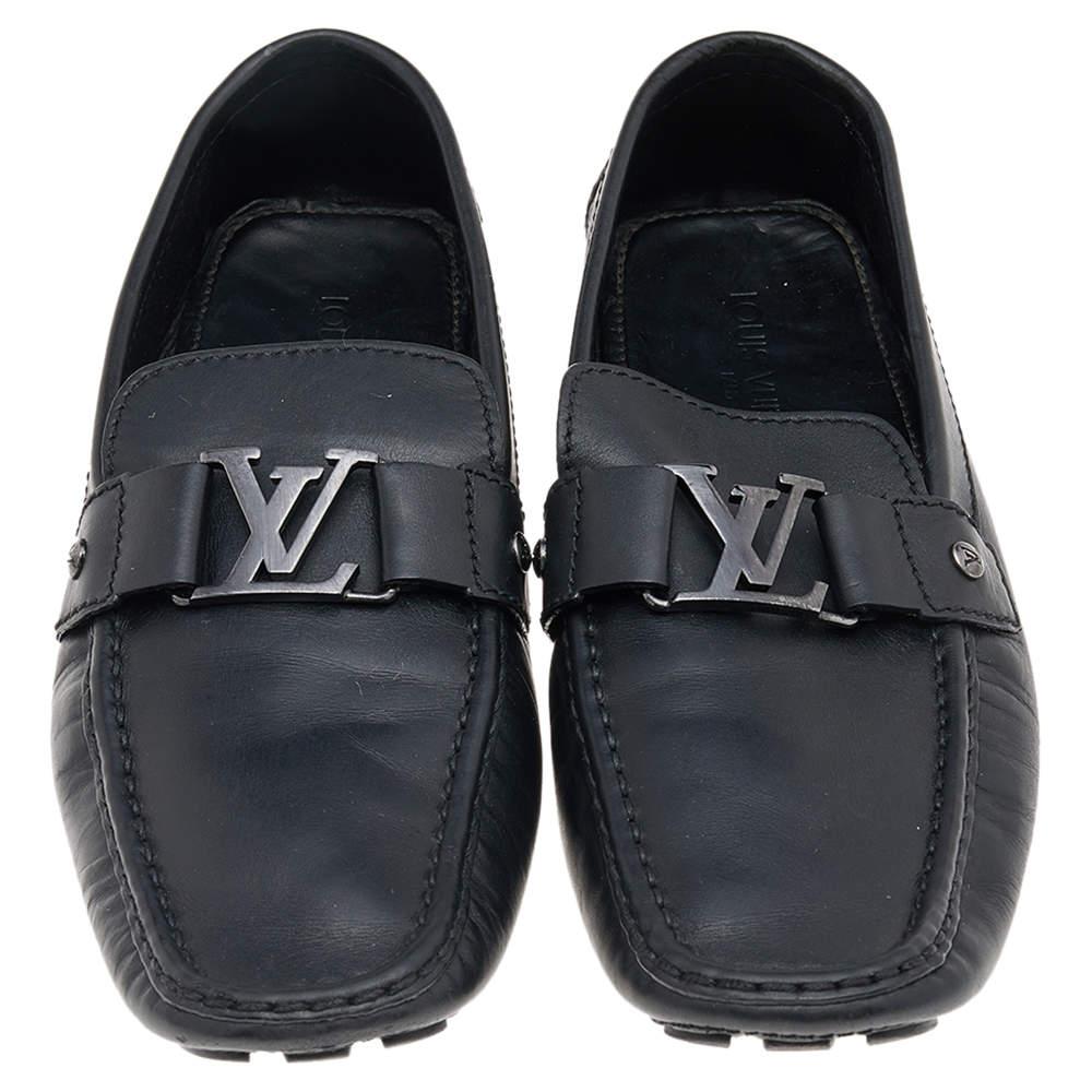 Look sharp and neat with this pair of Monte Carlo loafers from Louis Vuitton. They have been crafted from black leather and designed with the art of fine stitching and the signature LV on the uppers. The pair is complete with comfortable insoles and