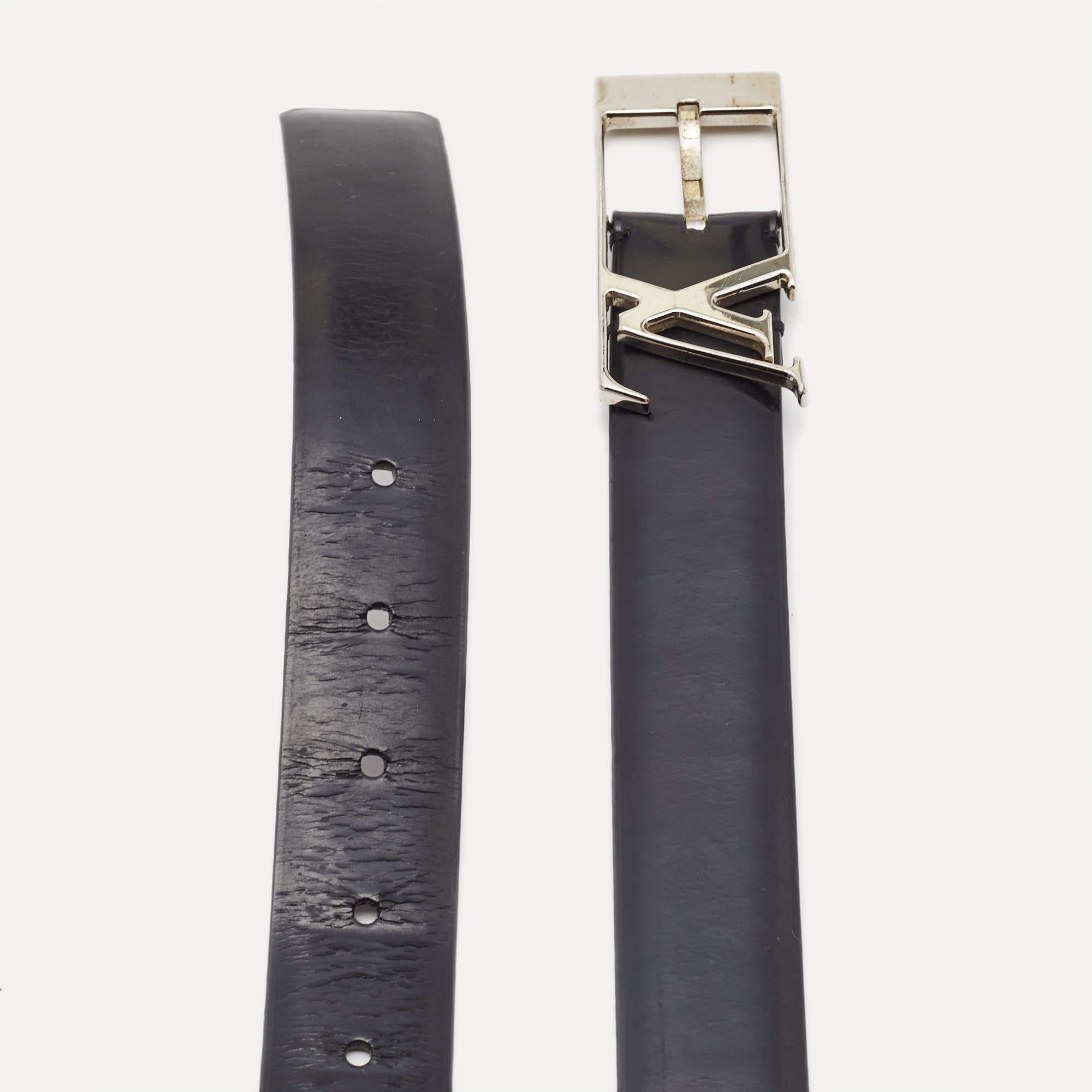Pick this subtle piece of accessory to upgrade your formal ensembles. The Neogram belt from Louis Vuitton is crafted with black leather. It features an LV logo and a buckle closure in silver-tone hardware.

