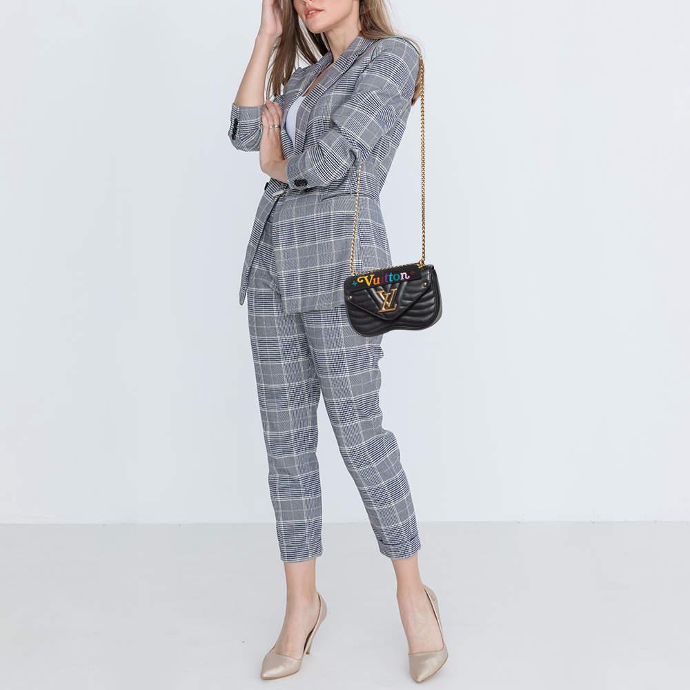 First released in 2018 the New Wave collection of bags carries a mixed design of both classic and edgy. This bag is crafted from black leather carrying a distinct wavy quilt pattern all over. The bag has the LV logo on the front flap and an