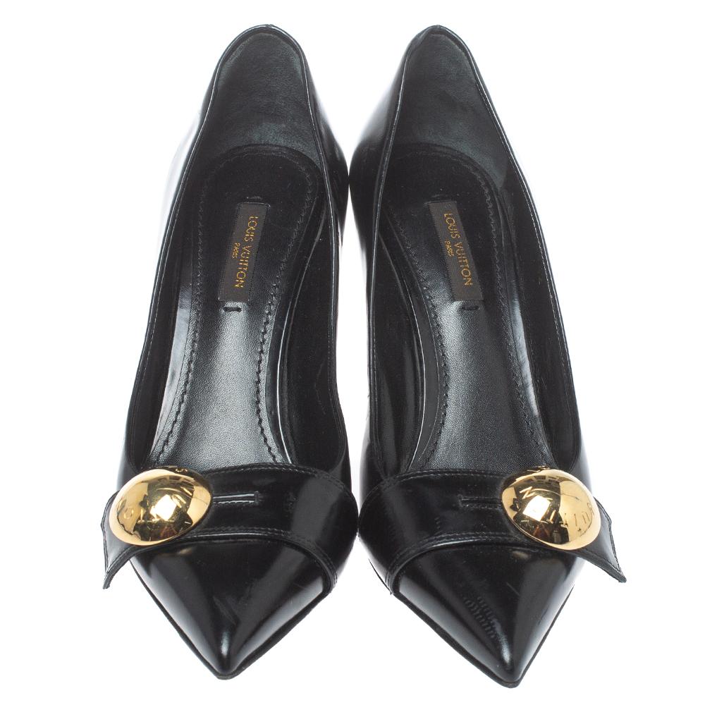 Louis Vuitton brings to you these lovely pumps to complement your fashionable ensembles. These black pumps are crafted from leather and feature an elegant silhouette. They flaunt pointed toes, gold-tone studded straps on the vamps, 7.5 cm heels, and
