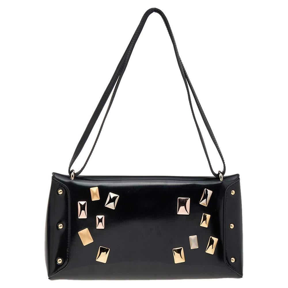 Louis Vuitton is known for its epic collection of bags and this one is as iconic as they come. The Sac Triangle bag is designed to deliver style and functionality. It has a geometric shape, is crafted from black leather, has dual leather handles, a