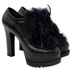 Louis Vuitton Schwarze Stiefel mit Absatz aus Leder & Shearling
