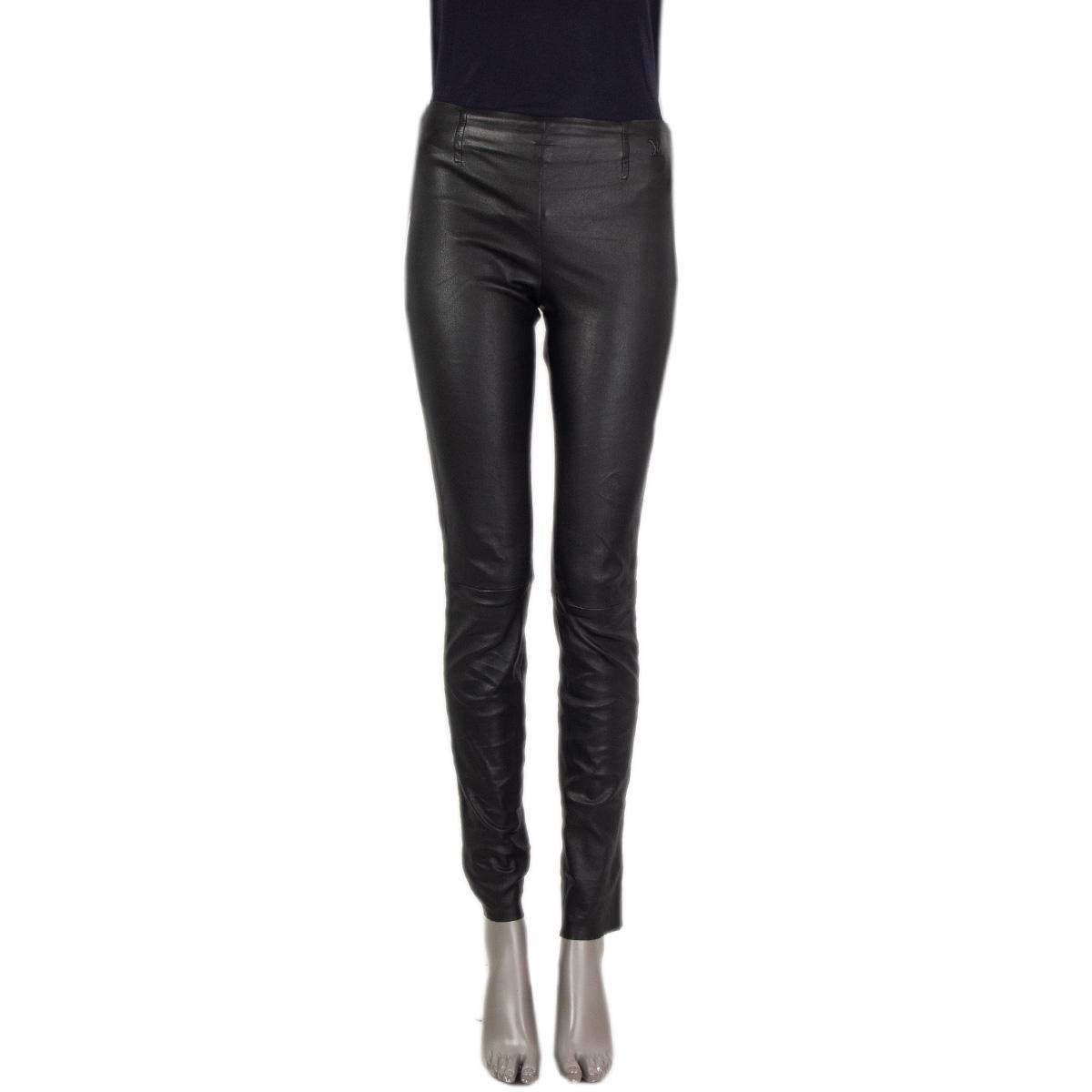 100% authentic  Louis Vuitton skinny leather pants in black lambskin (100%) with an embossed logo at the upper left side. Slip-in fit with an elastic band at the back waist-line. Unlined. Has been worn and is in excellent condition. 

Tag