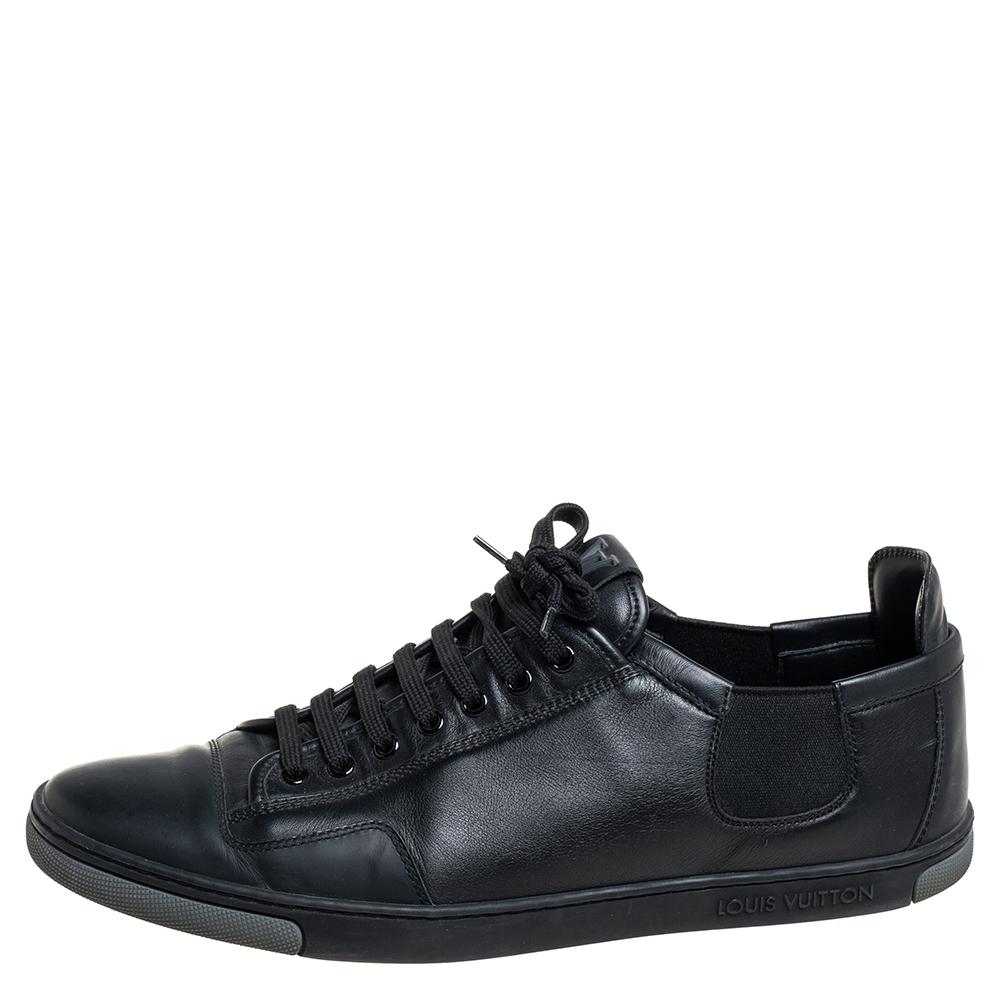 Get set to show off these smart and stylish low-top sneakers from Louis Vuitton. The Slalom sneakers are crafted from black leather and feature round toes, lace-ups on the vamps, and the LV logo on the tongues. They come equipped with comfortable