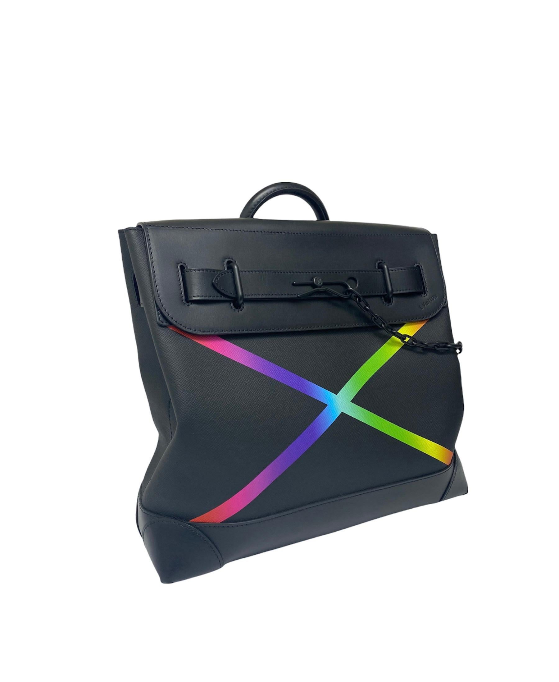 Louis Vuitton Limited Edition Taiga Rainbow x Virgil Abloh bag in black leather with black hardware.The bag is equipped with a front flap with interlocking strap closure with chain.The interiors are lined with a black fabric, and has three internal