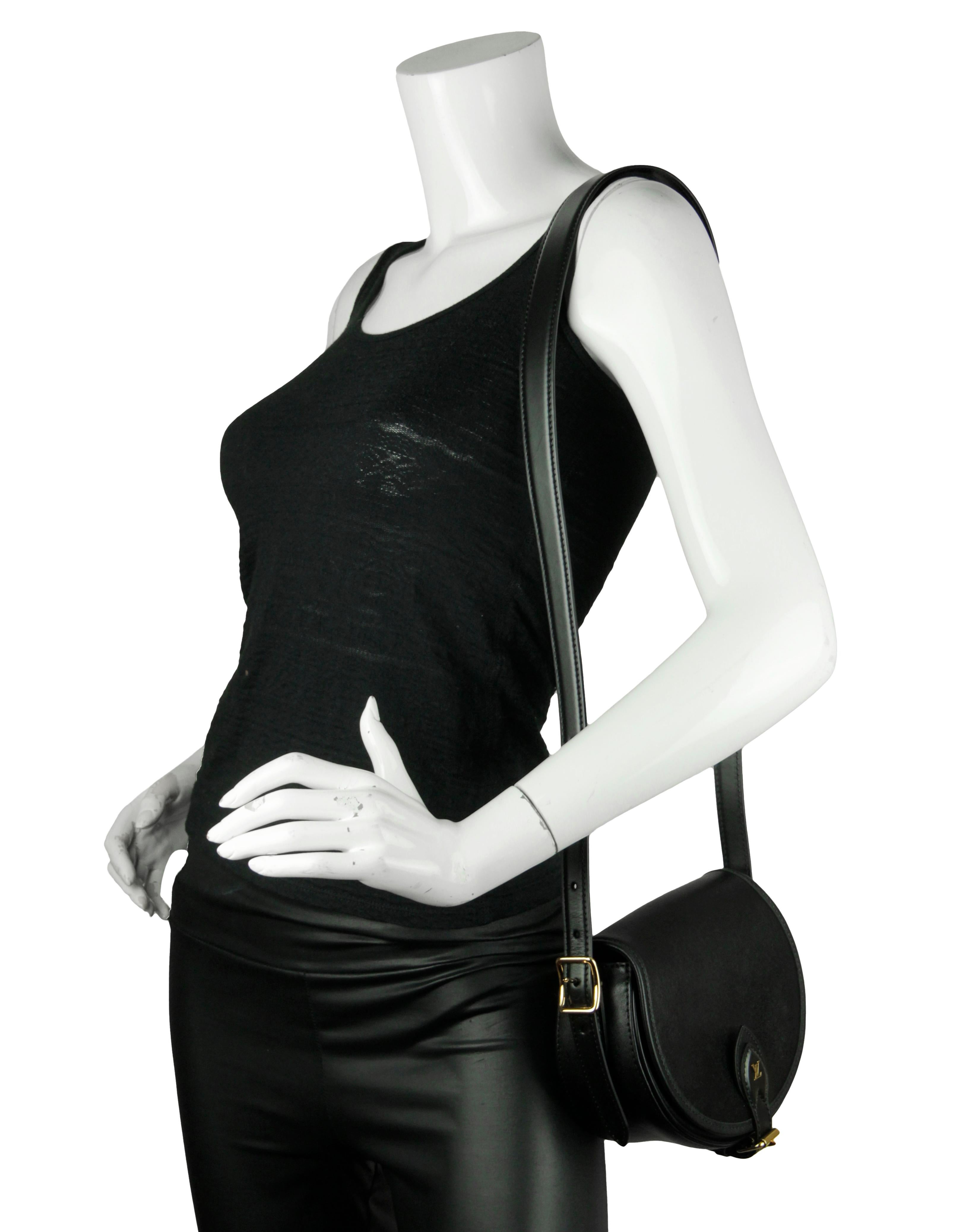 Louis Vuitton Black Leather Tambourin NM Crossbody Bag
Made In: Italy
Color: Black
Hardware: Goldtone
Materials: Smooth leather
Lining: Black microfiber
Closure/Opening: Flap top with buckle
Exterior Pockets: None
Interior Pockets: One flat
Exterior