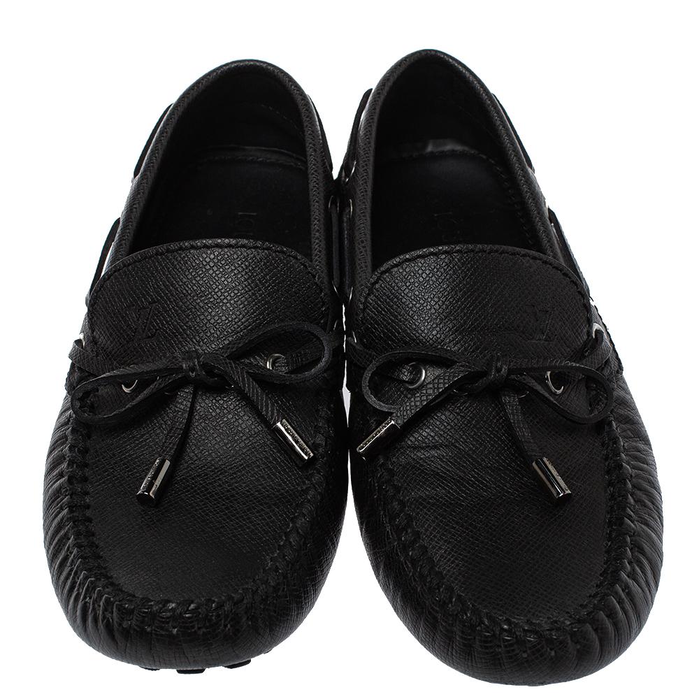 Louis Vuitton brings you these grand loafers that have been created with luxury in mind. They are covered in black-hued leather and detailed with tassels on the uppers and leather insoles meant to offer comfort in every step. The loafers are a