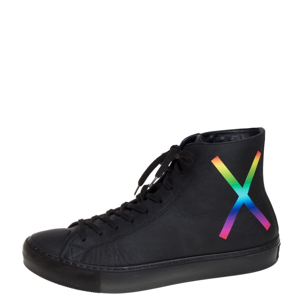 Now here is one pair that knows how to make you look effortlessly stylish! These Tattoo high-top sneakers from Louis Vuitton are finely crafted from leather and fabulously designed with round toes, lace-ups on the vamps, and 'X' and 'O' rainbow-hued