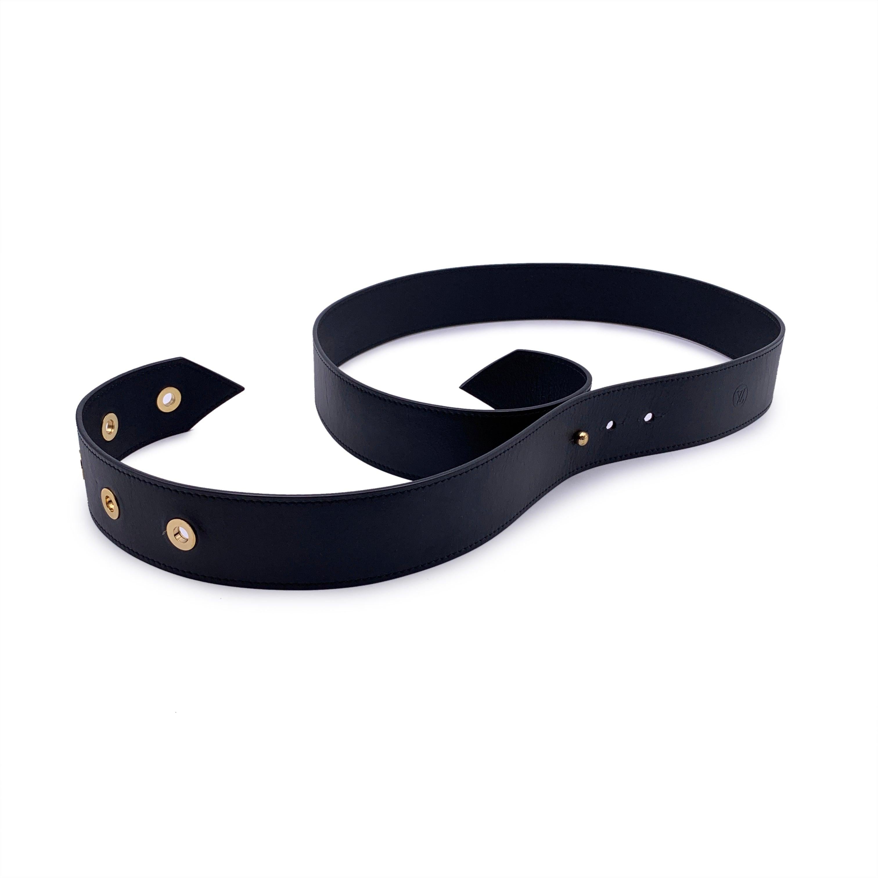 This beautiful belt will come with a Certificate of Authenticity provided by Entrupy. The certificate will be provided at no further cost. Louis Vuitton Tie the Knot Black Leather Eyelet Belt, mod. MP146. From the Fall 2014 collection. Crafted in