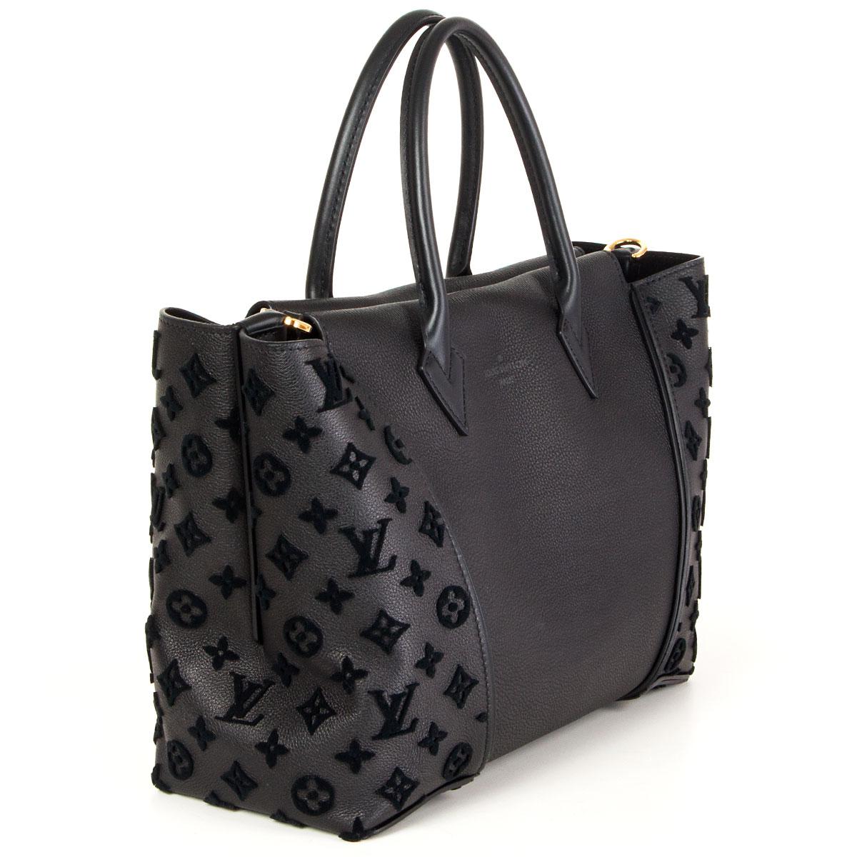 100% authentic Louis Vuitton W PM tote in black Orfevre and Veau Cachemire leather with tufted monogram. Closes with a magnet on top. Lined in suede with a zipper pocket against the front and an open and zipper pocket against the back. Brand new.