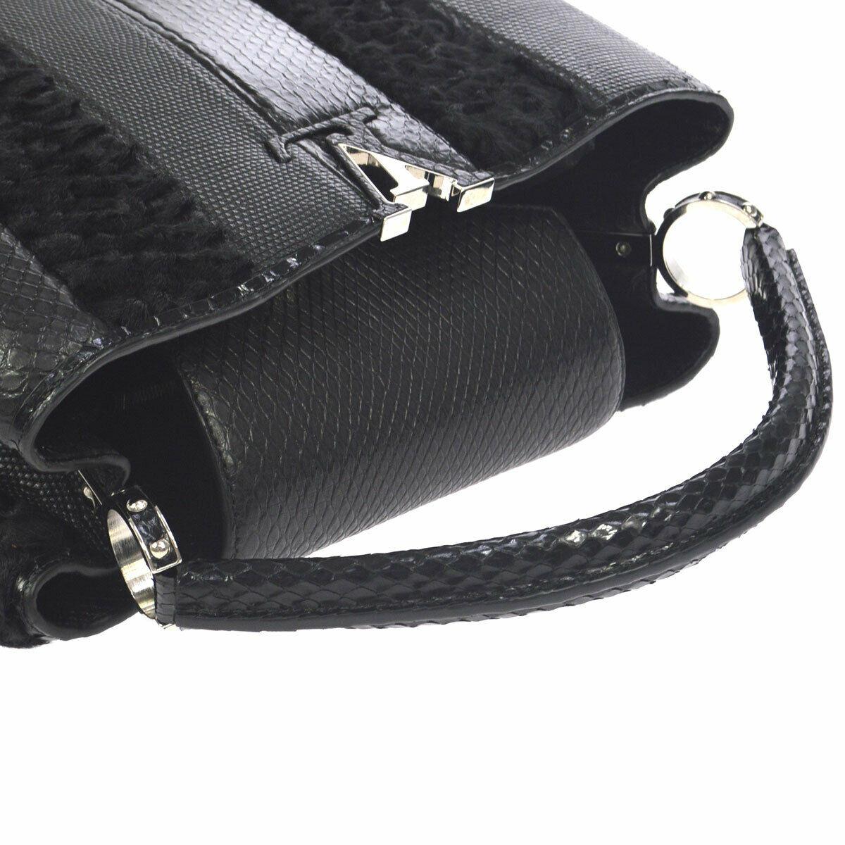Louis Vuitton Black Lizard Crocodile Exotic Silver Top handle Satchel Bag in Box

Crocodile
Lizard
Leather
Silver tone hardware
Leather lining
Date code present
Made in France
Handle drop 5