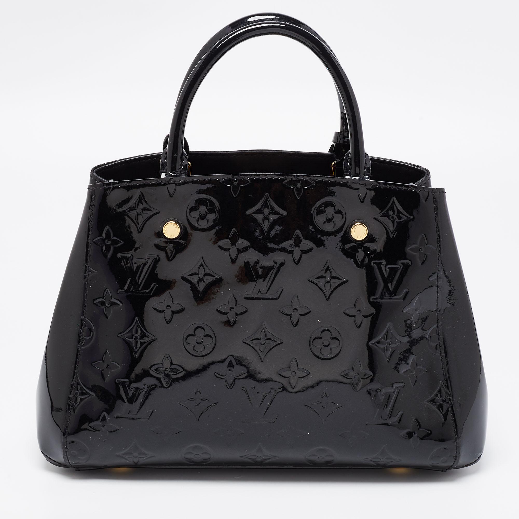 A handbag should not only be good-looking but also functional, just like this Montaigne bag from Louis Vuitton. Crafted from luxurious patent leather, this gorgeous piece has the signature logo-engraved padlock and a top that opens up to a spacious