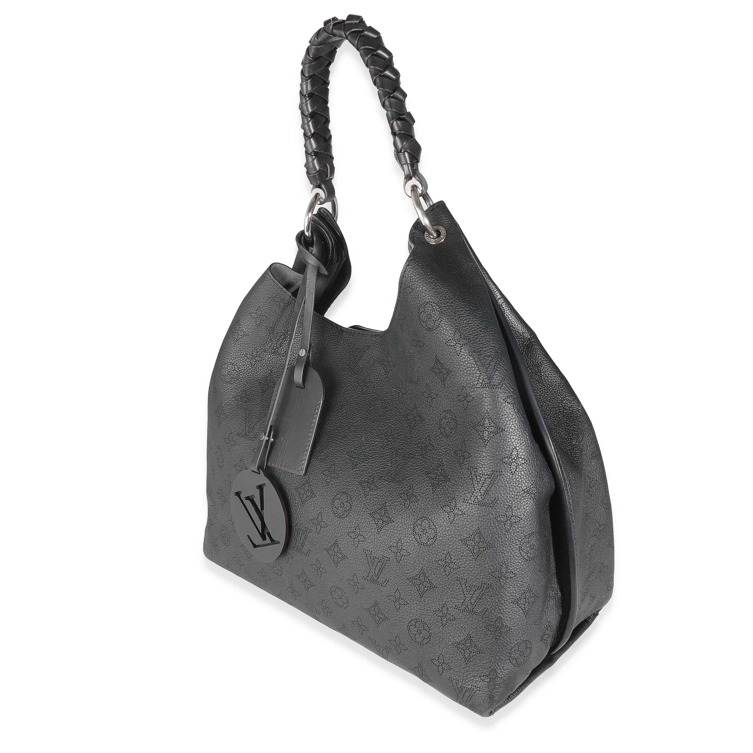 Listing Title: Louis Vuitton Black Mahina Carmel Hobo
SKU: 140932
MSRP: 5000.00 USD
Condition: Pre-owned 
Handbag Condition: Very Good
Condition Comments: Item is in very good condition with minor signs of wear.  Moderate corner scuffing. Scratching