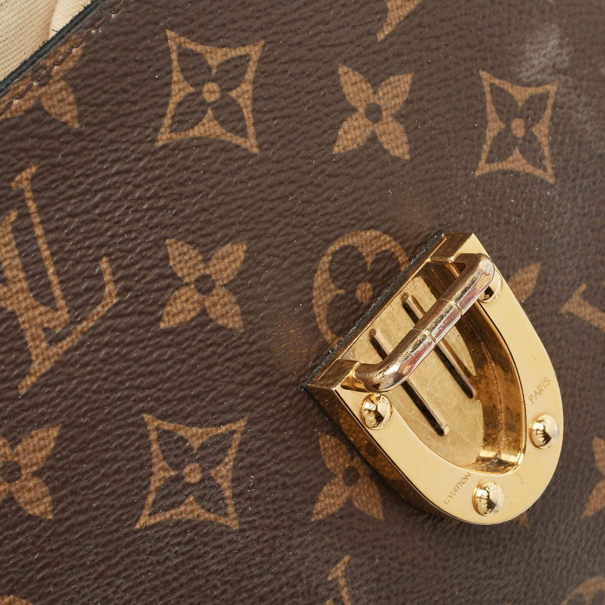 Louis Vuitton Borsa Monogram nera in tela e pelle con un manico e patta MM In condizioni buone a Dubai, Al Qouz 2