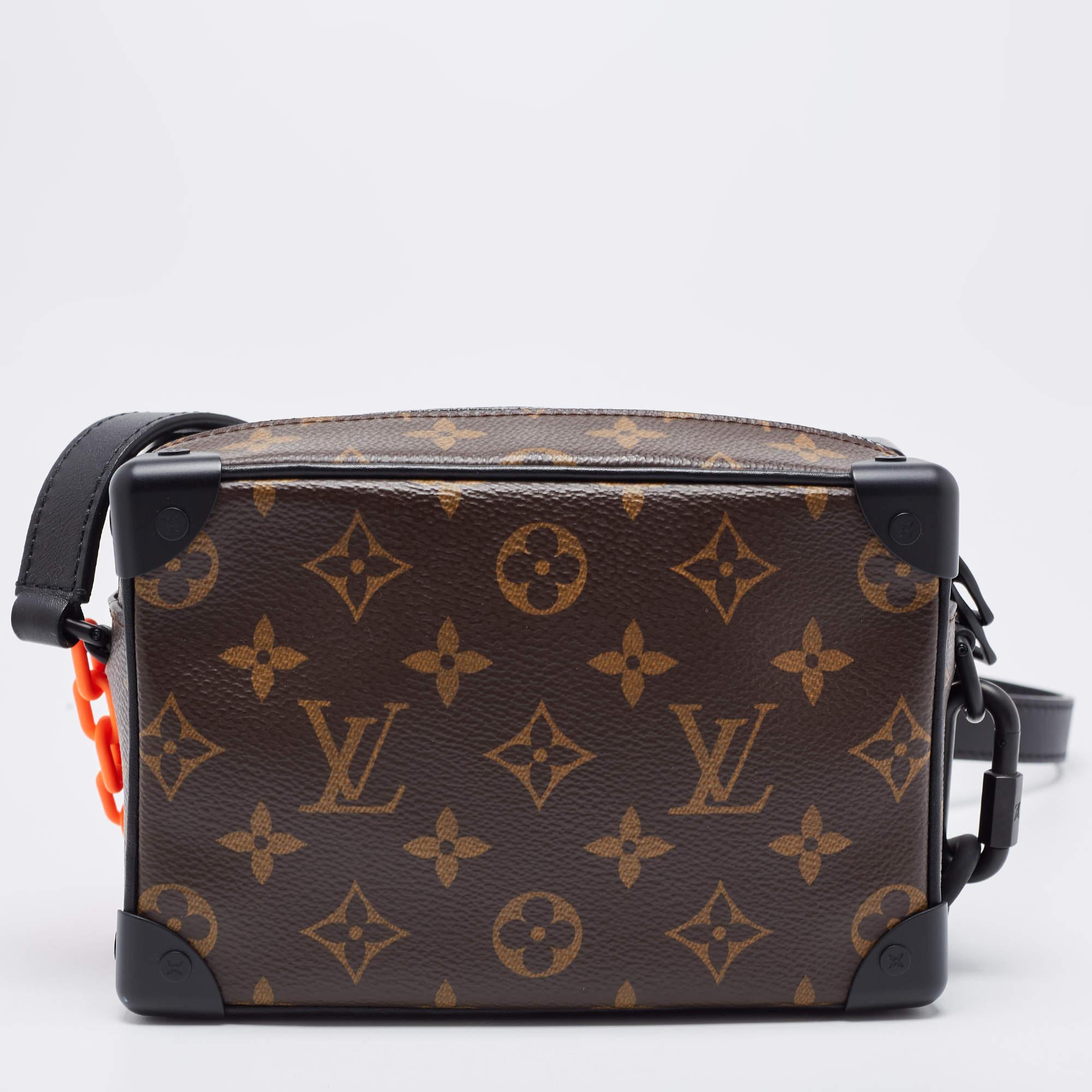 The Louis Vuitton Black Monogram Canvas Mini Solar Ray Soft Trunk Bag is a luxurious accessory, featuring the iconic LV monogram canvas with a unique solar ray pattern. It boasts a compact size, a black leather trim, and a detachable strap for