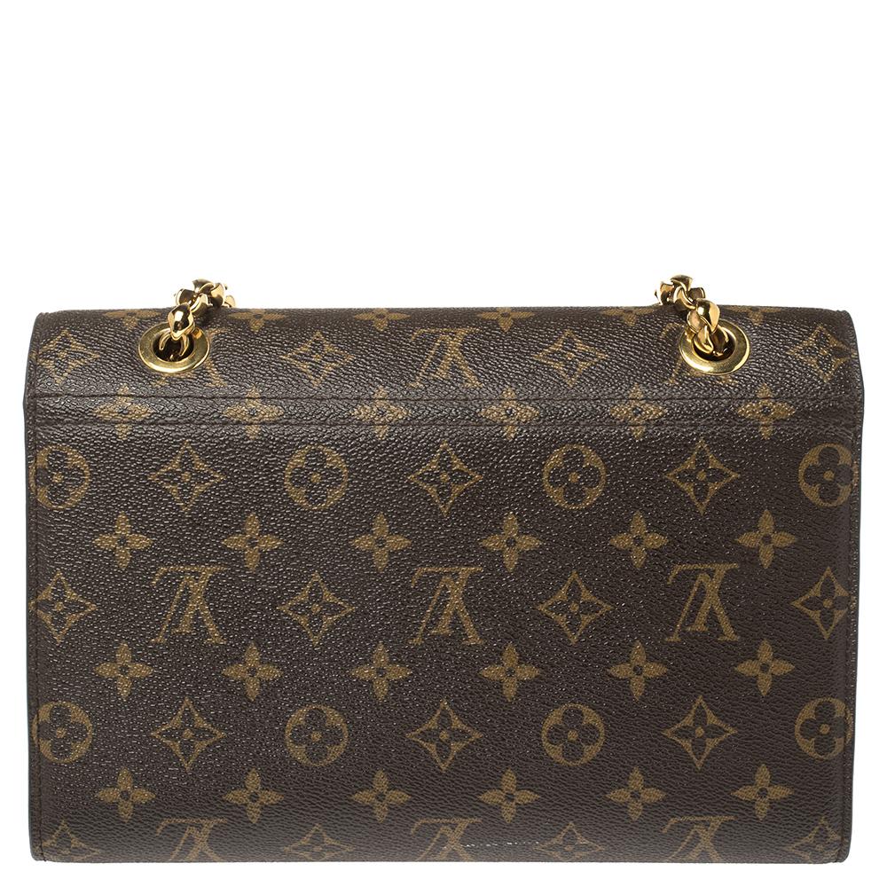 The excellent craftsmanship of this Louis Vuitton bag ensures a brilliant finish and a royal appeal. The Victoire bag pairs monogram canvas with smooth leather for a sophisticated day-to-evening accessory. The gold-tone closure is modeled on the