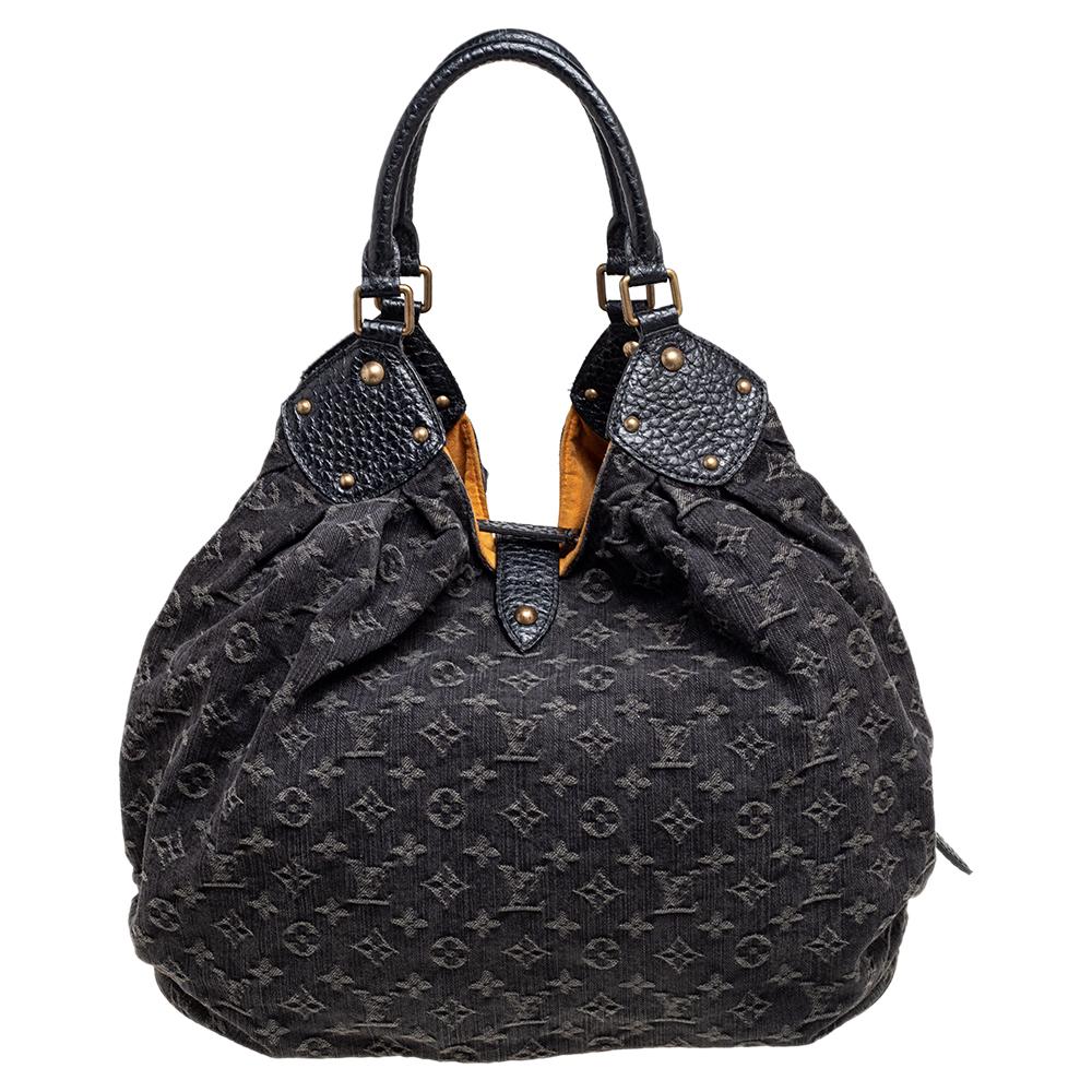 This Louis Vuitton Surya bag is designed exquisitely. Its name is inspired by the Hindu Sun God, Surya. Feminine and chic, this slouchy bag is roomy and perfect for everyday use. Crafted from monogram denim and leather, it features top handles, a