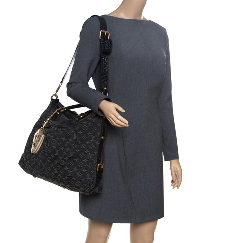 Louis Vuitton's handbags are popular due to their high style and functionality. This Neo Cabby GM bag is durable and stylish. Crafted from black monogram denim, the bag comes with two leather handles, a detachable shoulder strap, belt details to the