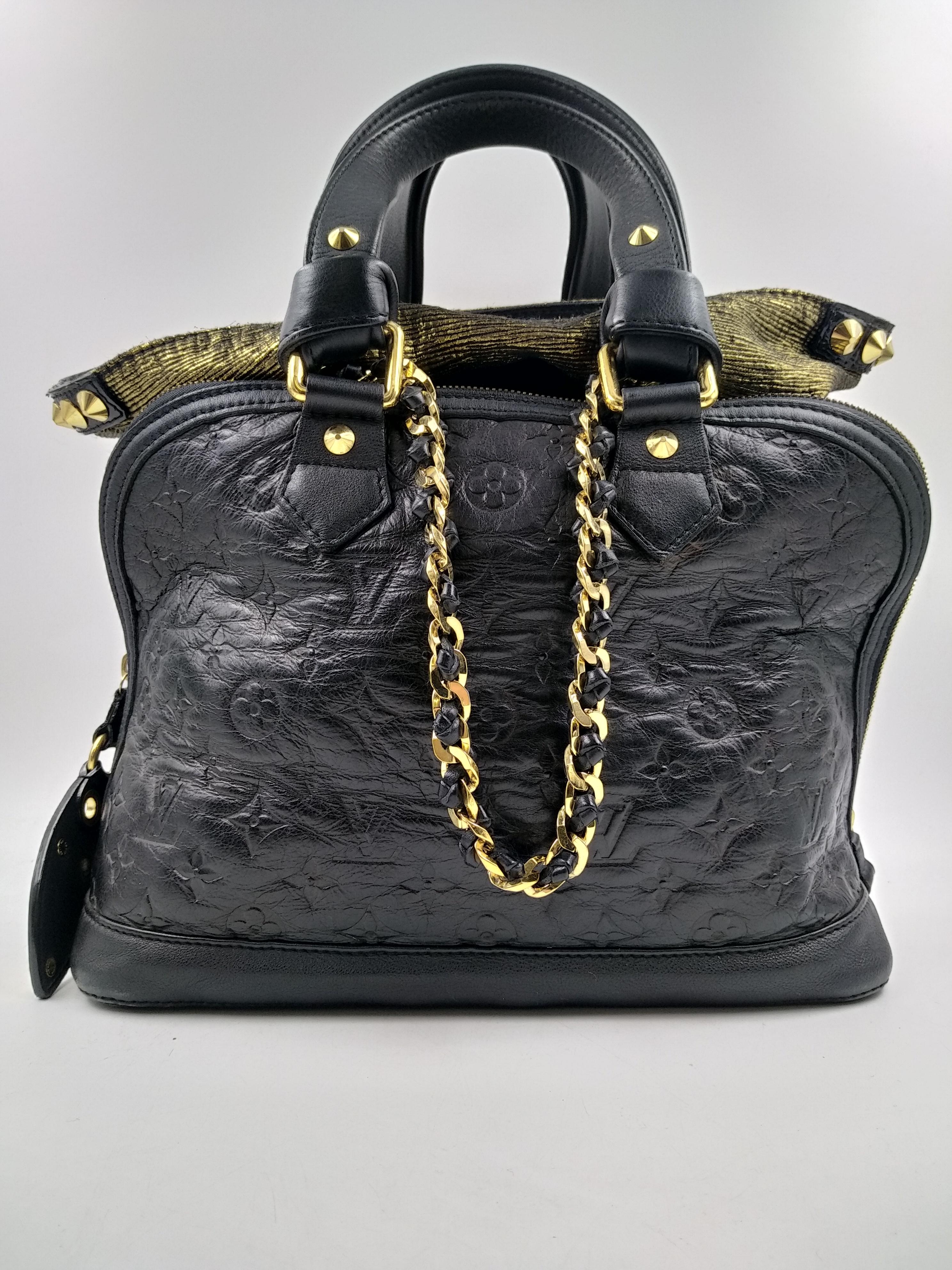 Louis Vuitton Black Monogram Double Jeu Neo-Alma Bag, Limited Edition 2009/2010
- 100% authentic Louis Vuitton
- Inside the Monogram embossed leather Alma, there is completely separate bag made of jacquard textile with metallic threads that can be