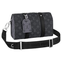 Louis Vuitton Black Monogram City Keepall XS Grey Leather Cloth Pony-style  calfskin ref.546040 - Joli Closet