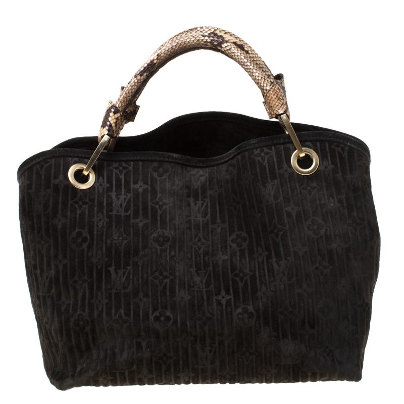 This Limited Edition Louis Vuitton Kohl Whisper is very chic. Made from supple black suede with monogram embossed pattern, this fabulous bag features python leather handles, LV engraved padlock at the front bottom, python leather clochette and an