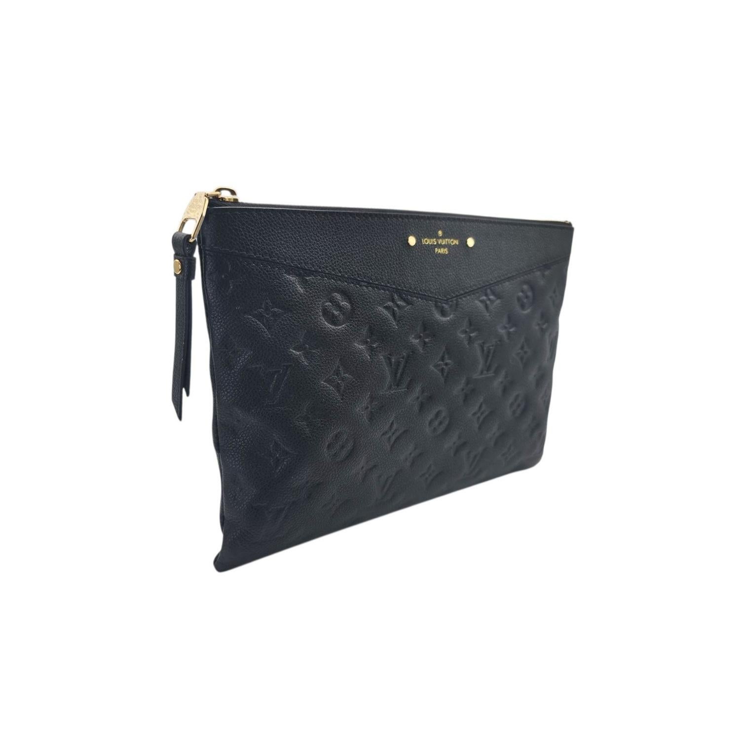 The Louis Vuitton Monogram Empreinte Daily Pouch showcases refined craftsmanship in black grained cowhide embossed with the iconic monogram pattern. Featuring polished gold-tone hardware and a top zip closure, it opens to a sleek black fabric