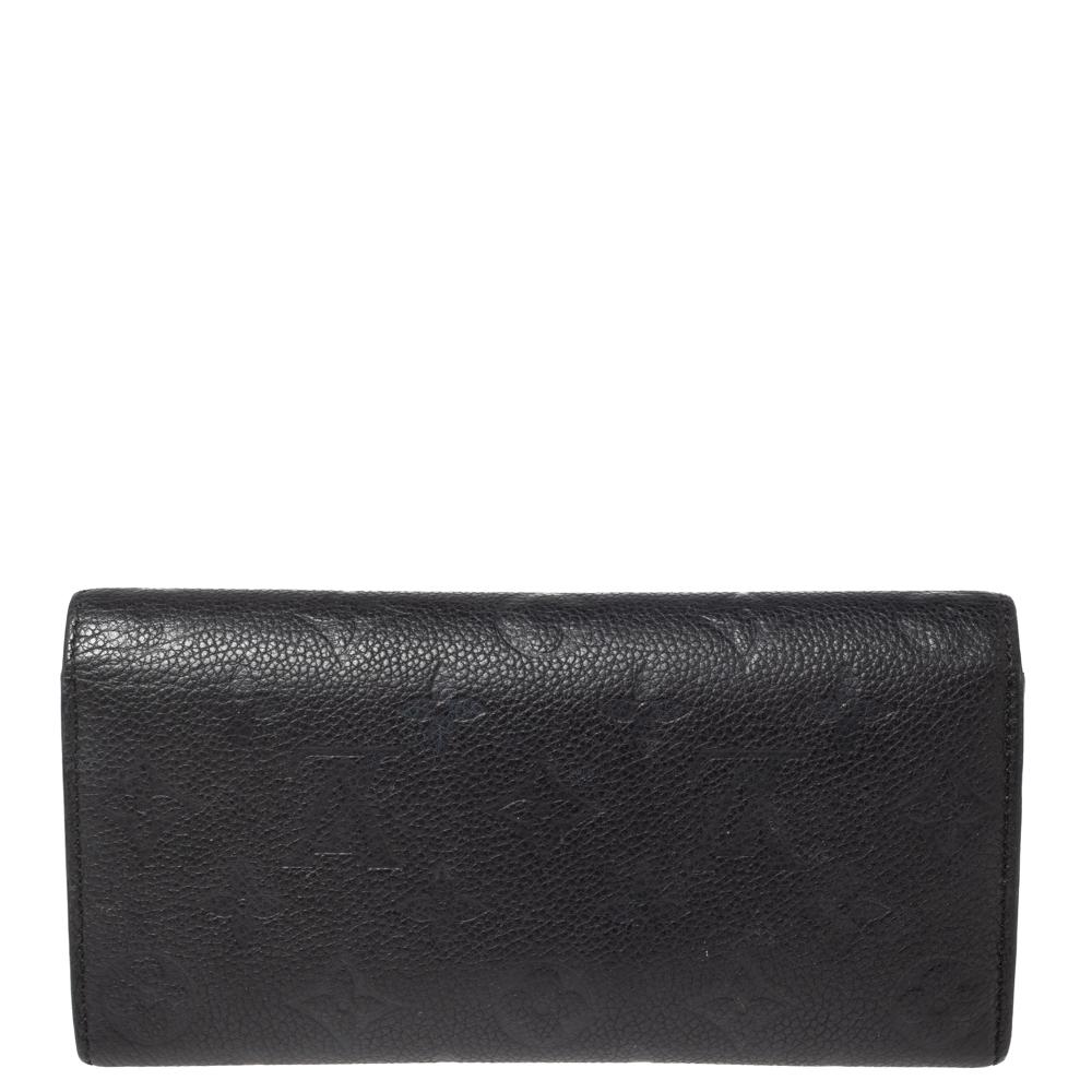 Proving that functionality and beautiful design can exist together, the Emilie wallet is elegant and perfect for daily use. Made from monogram Empreinte canvas, it comes with a zipper compartment and press-stud closure. Slide it into your tote or