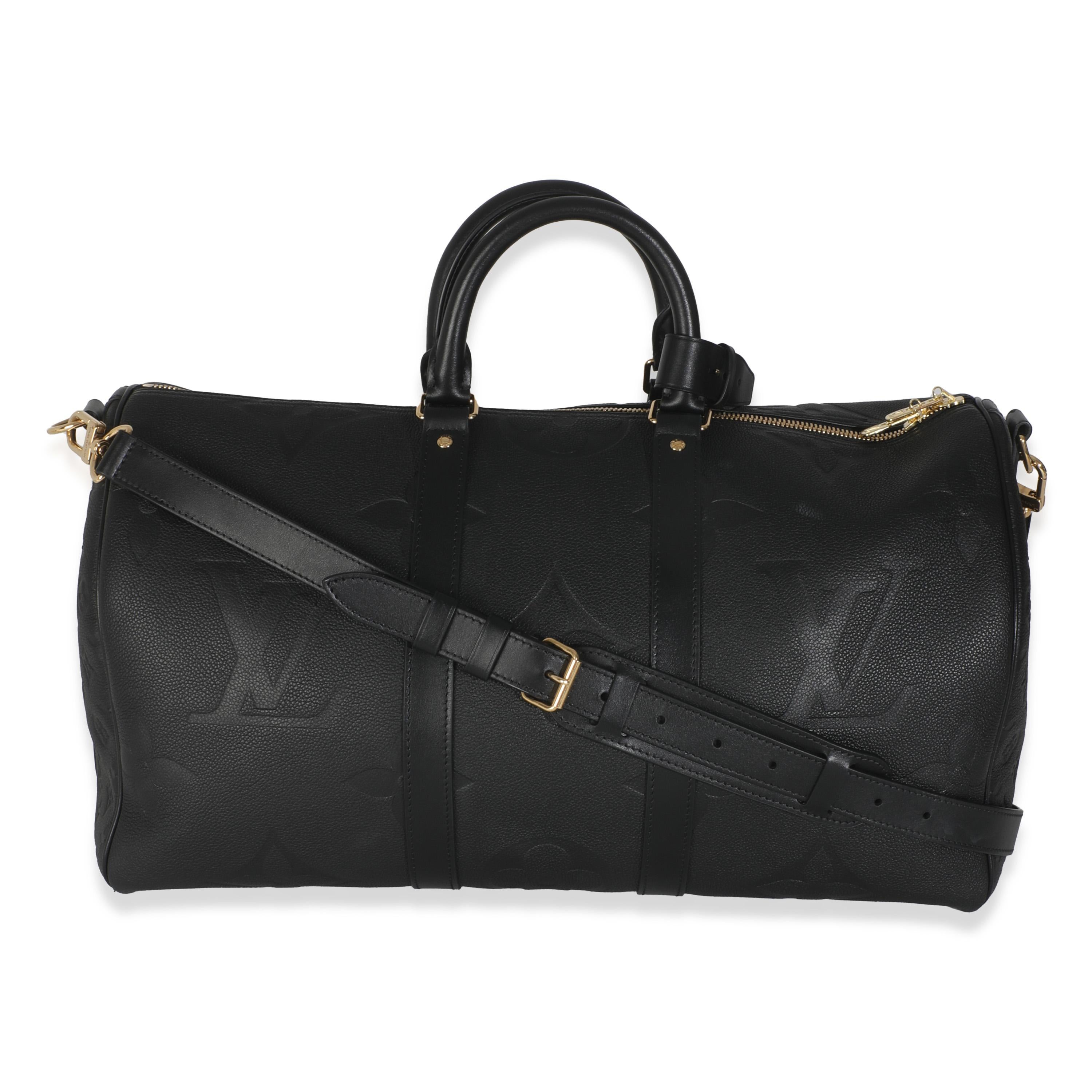 Listing Title: Louis Vuitton Black Monogram Empreinte Giant Keepall Bandouliere 45
SKU: 145952
MSRP: 3800.00 USD
Condition: Pre-owned 
Condition Description: An early 20th-century design from Louis Vuitton, the Keepall bag is the epitome of the