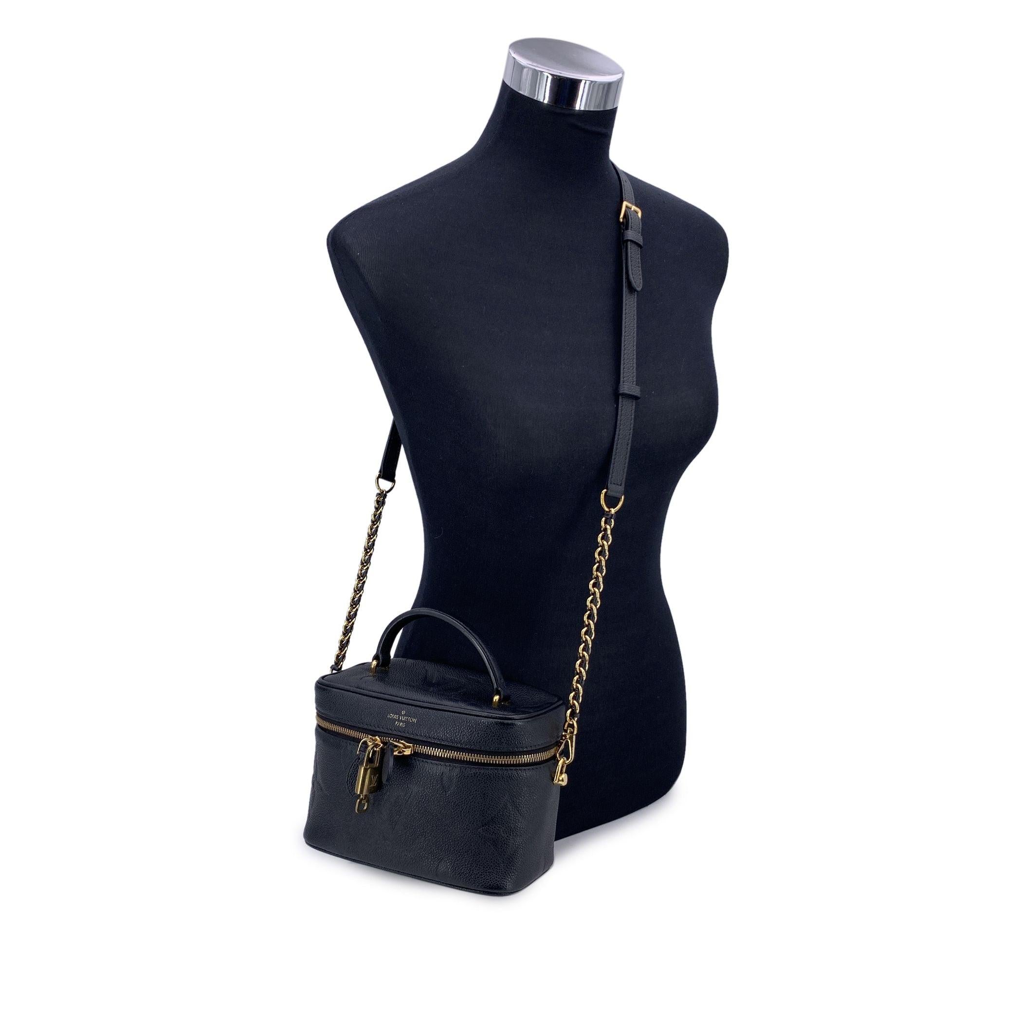 This beautiful Bag will come with a Certificate of Authenticity provided by Entrupy. The certificate will be provided at no further cost. Discover the epitome of luxury with this authentic Louis Vuitton Empreinte Monogram Giant Vanity PM in black